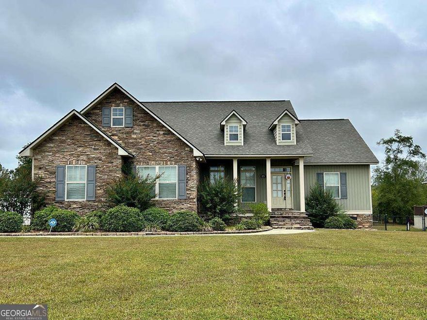 This 3 bedroom 2 bath cottage style home features large front porch, back deck, fenced yard, alarm and more.  The kitchen is open to the family room and dining area. LVP flooring was installed in 2019 throughout the home.  Kitchen features tiled back splash, quartz countertops, breakfast bar, SS appliances, pantry, breakfast area with coffee Bar and built in desk.  Dining room with cased opening to foyer and family room. Split floor plan. Master suite with trey ceilings, double sinks in vanity, walk-in closets, large tiled shower with 3 shower heads and shower seat. Other features include lots of large windows with lots of natural light & paved driveway with extra parking area.  May 2022: repainted interior of home, new shutters throughout the home, micro-vent, dishwasher, refrigerator, tiled shower in master bath, tiled floors in master bath, wireless keypad for garage door.  Call today to see.