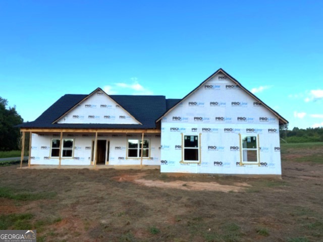 This stunning new construction custom home features 4 spacious bedrooms and 3 beautifully designed bathrooms, perfect for comfortable family living or entertaining guests. The open floor plan seamlessly connects the large kitchen-complete with modern finishes and generous counter space-to the inviting living and dining areas. The expansive primary bedroom offers a peaceful retreat with ample space and natural light. Situated on a desirable corner lot, the home boasts breathtaking views of the river just across the street, which connects directly to Lake Oconee, offering both scenic beauty and recreational opportunities. This home is the perfect blend of luxury, functionality, and natural charm.