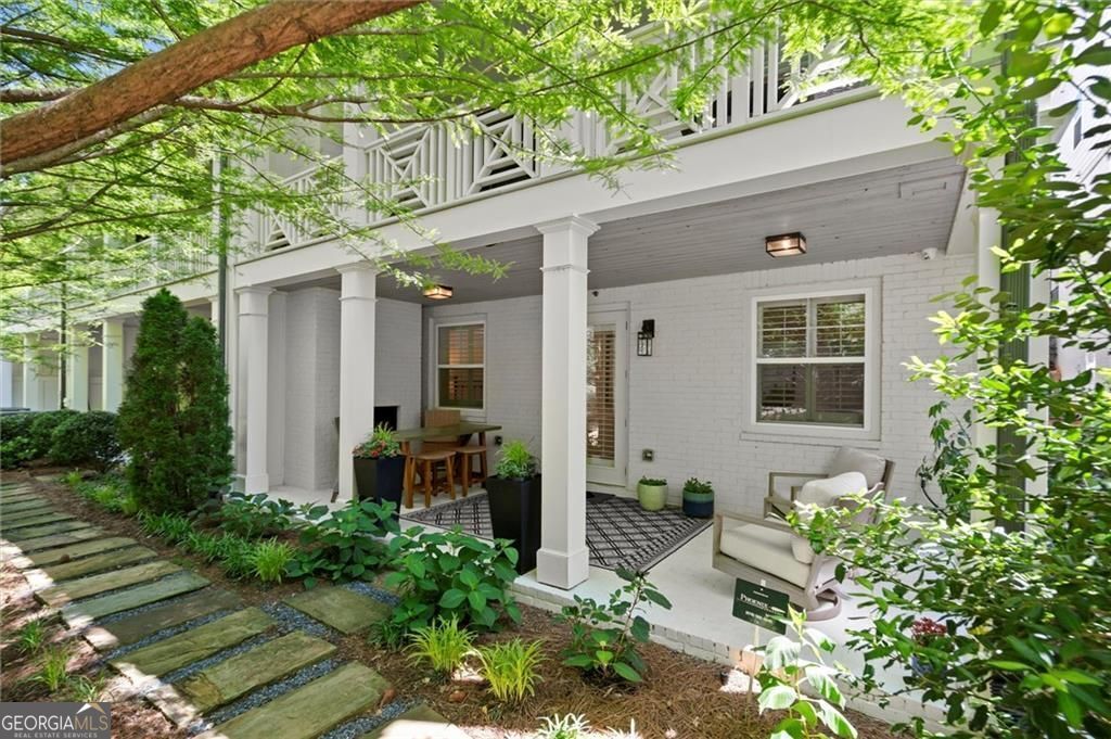 Live on the Alpha Loop ....Just Steps from Downtown Alpharetta & Avalon This 4-bedroom, 3.5-bath townhome truly has it all, starting with one of the best locations in Alpharetta. You can walk right in from the street with no stairs to climb, which is a rare find! And for added convenience, there's a private elevator that services all three levels. Inside, the open floor plan makes everyday living and entertaining easy. The kitchen opens to the family room, with a large center island for plenty of seating, upgraded stainless steel appliances, and a cozy gas fireplace in the family room. One of my favorite features? The main-level covered porch....oversized and private, with a brand-new outdoor fireplace, ceiling fans, and retractable shades. It overlooks the Alpha Loop and is perfect for relaxing no matter the season. Upstairs, the owner's suite is oversized with a sitting area that can be closed off with glass French doors...great for a home office or quiet retreat. The owner's bath is stunning with double vanities, a soaking tub, huge walk-in shower, and a custom California Closets system, plus a built-in makeup vanity with lighting. Laundry is accessible from the hallway or right through the closet, super convenient. You'll also find two more bedrooms and a full bath on this level. Downstairs, the terrace level is set up for entertaining with a large living space, custom bar area with an ice maker and beverage fridge, a large bedroom and full bath, and access to a second covered porch....yes, with another fireplace and ceiling fans! Other upgrades include a 2-car garage with epoxy floors, extra storage, California Closets throughout, a built-in Sonos sound system, and again...don't forget the elevator, which makes moving between floors effortless. But the best part? This townhome sits right on the Alpha Loop, so you can easily walk to all the restaurants, shops, and events in Downtown Alpharetta or Avalon. It's the perfect mix of luxury, location, low-maintenance living and lifestyle!