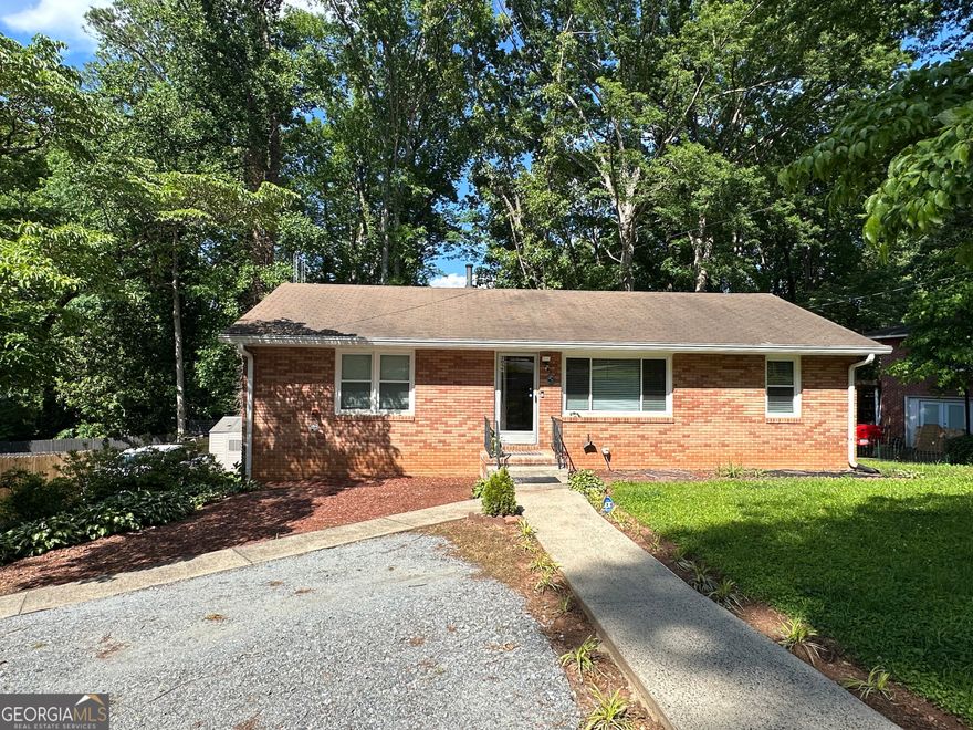 Welcome to 2059 Clearwater Drive, a beautifully maintained 4-sided brick home in the heart of Marietta, offering an exceptional blend of comfort and investment potential. This home, with no HOA, features extensive upgrades and is ideally located just off Powers Ferry Road, providing easy access to major routes, shopping, dining, and more. The property is perfect for multi-generational living or generating rental income, thanks to the two custom-designed basement efficiencies with independent access.    The main level boasts a bright living room, dining area, updated kitchen with integrated laundry, 2 bedrooms, and 1 full bath.    Efficiency #1: Side entrance with elegant French doors, full kitchen, living room, 2 additional rooms that can be used as bedrooms, spacious bathroom, and laundry.  Efficiency #2: Rear deck entrance, 1 bedroom, full bath, and kitchenette (no laundry).    Additional highlights:    Large wooden back deck, perfect for outdoor entertaining    New LED light fixtures throughout    Extensive security system with multiple new cameras    Partially fenced backyard with ample parking    Furniture may be included, if desired by the purchaser    Location Perks:    Convenient access to Powers Ferry Road and nearby Interstate 75, making commuting to downtown Atlanta, Cumberland Mall, and Truist Park a breeze.    Just minutes from The Battery Atlanta and Cumberland Parkway, offering a variety of dining, entertainment, and shopping options.    Located in a quiet neighborhood, yet close to major conveniences, offering the best of both worlds.    This property has been intensively modified and thoughtfully maintained, offering not only comfort and style but also significant investment potential in a prime, well-connected location.