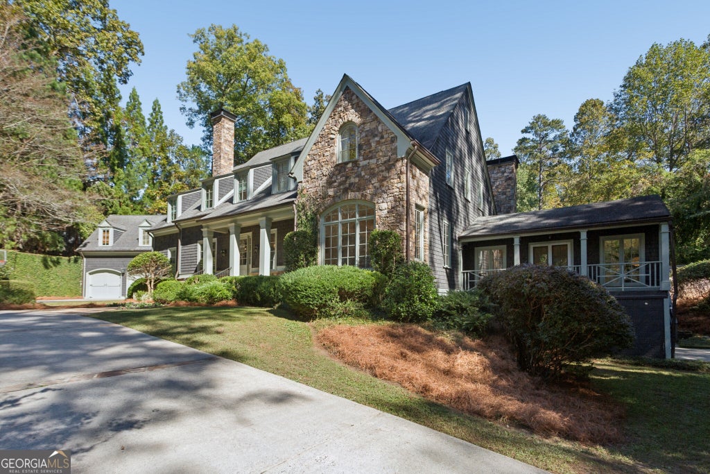 Photo of 4065 Beechwood Drive NW, Atlanta, GA 30327 (MLS # 10879395)