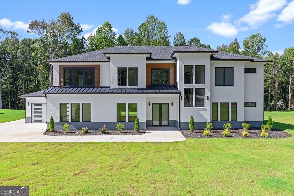 This stunning country "estate" sits proudly on acre-plus lot with over 500' of road frontage. Dramatic soaring ceilings and HUGE fixed windows and slider doors create allow for incredible natural light. The kitchen is well-appointed with custom cabinetry, massive quartz island, and Cafe appliances. AND... a scullery with more cabinets, preparation space, second dishwasher, cooktop and sink! Junior primary suite on main level has second laundry location in the large walk-in closet. Office/ study on main has bookshelves and cabinetry. Wonderful outdoor space includes enormous covered patio and very level back yard. Massive loft on second level with built-ins and floating shelves. This is the perfect kid hang-out or TV room. Primary suite features sexy bathroom with wetroom. Engineered wood floors throughout! No carpet anywhere. All bathrooms include full showers with beautiful marble tile walls and floors. Statement light fixtures throughout. All closets have systems. No wire shelving anywhere! Spray foam insultion. Builder inclues a 2/10 Homebuilder's warranty. This could be the one! So much value when you compare other new construction price per sqaure foot.