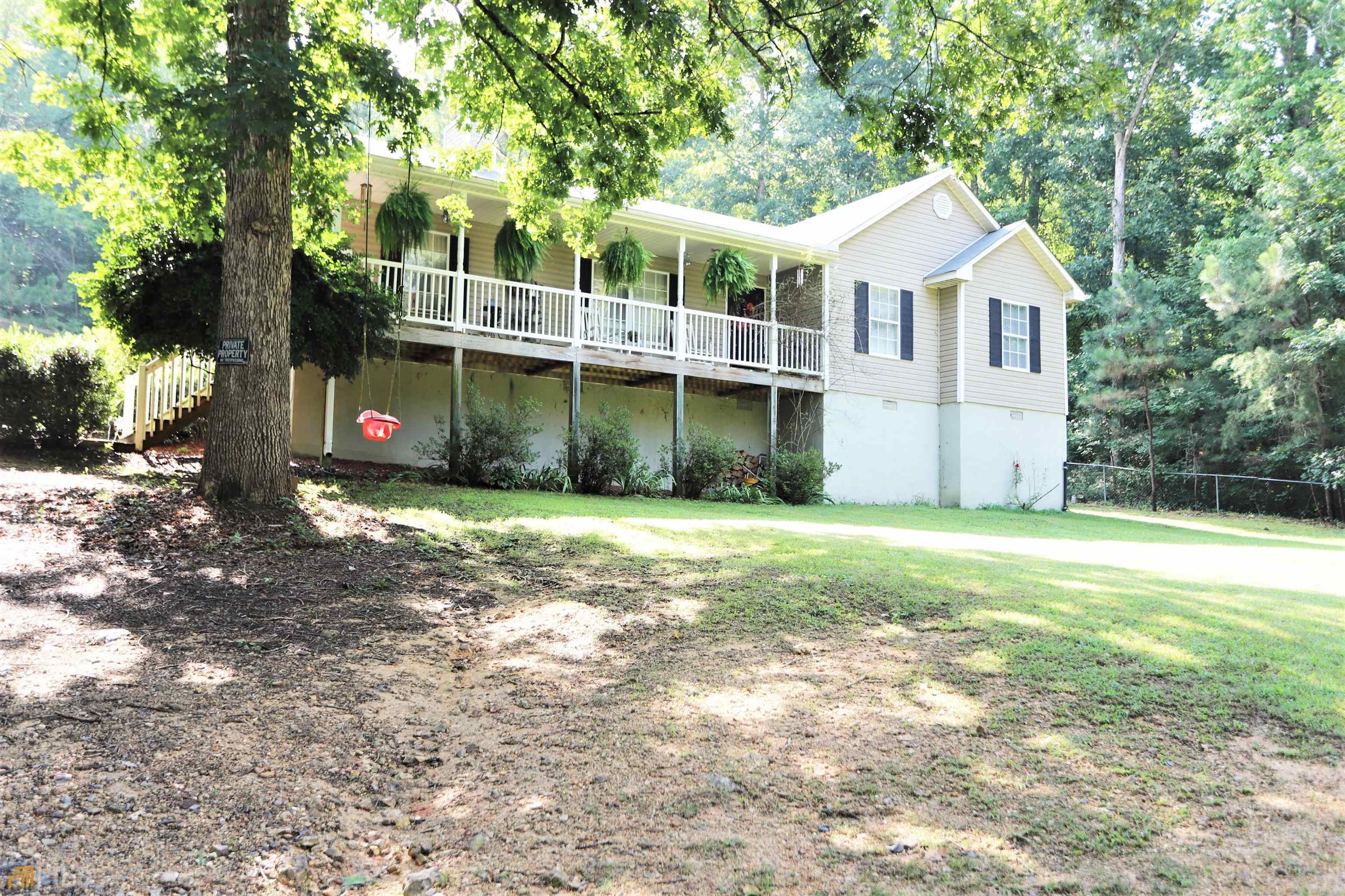 First time offered this well kept ranch has much to offer, you enter the front from a full covered porch that overlooks the yard, then step into a nice size family room with a stone fireplace, immediately to the left is a large master suite with tub, shower and a walk-in closet, from the family room you enter a well arranged dinning/kitchen area combined with a large storage room and pantry, down the hall is a half bath, a huge walk-in closet and laundry room that could very easily be re-arranged to a 4th bedroom, also there is a guest bedroom and another bedroom suite with a bath, outside there is an awesome backyard with above ground pool with a large deck for entertaining, also included is a freestanding metal carport and a couple of outbuildings for storage, the home is situated on a very private .42 acre lot with a private driveway. The owner is relocating, Call today to view this home, just minutes from Trion and Lafayette on Trion Highway.