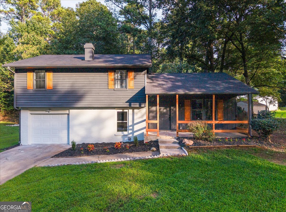 Welcome home to this tastefully renovated Ellenwood residence. A welcoming rocking-chair front porch sets the tone for the thoughtful upgrades found throughout. Inside, you'll find a bright, modern layout with new flooring, fresh interior and exterior paint, updated lighting, and new plumbing fixtures. The kitchen boasts new cabinetry, new stainless steel appliances, quartz countertops with a solid slab backsplash and access to the back patio that is perfect for relaxing and entertaining. Upstairs there are 3 bedrooms including the spacious owners suite. This move-in ready home blends comfort and practicality, perfect for everyday living and entertaining.