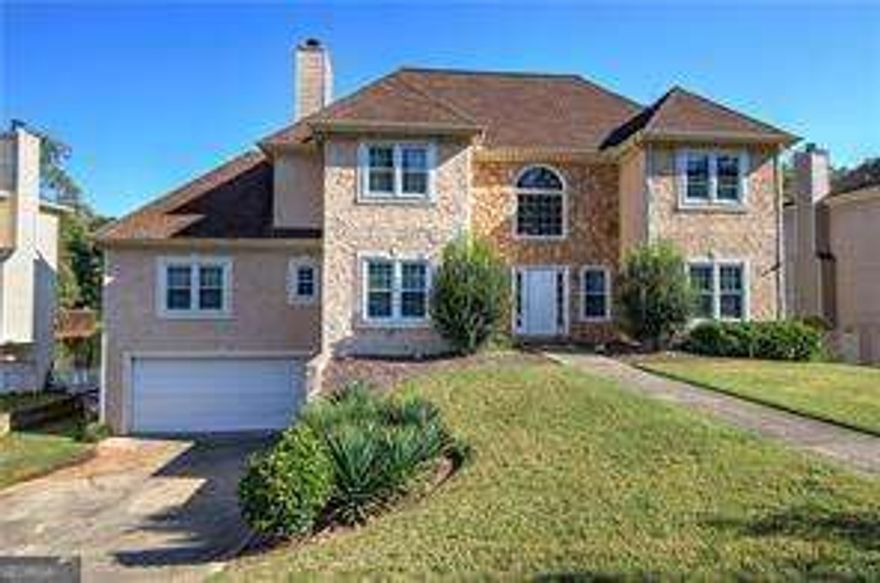 **Stunning Lakefront Property with Spacious Deck and Exceptional Features**      Welcome to this beautiful lakefront home featuring a large back deck that overlooks the serene community lake, a perfect spot for relaxing or entertaining. The spacious foyer leads to a grand two-story living room with lots of windows that fill the room with natural light, complemented by a built-in bookcase for added charm.    You'll love the kitchen with white cabinetry,  tiled backsplash, stainless steel appliances including new fridge in 2022, abundant counter space, and a cozy breakfast nook for casual dining. The main-level master suite is a true retreat, offering a vaulted ceiling, a large walk-in closet, and a cozy gas fireplace. The ensuite bath features two vanities, a soaking tub, and a large separate shower. Upstairs, you'll find two well-sized bedrooms with a shared bath, plus an additional bedroom with its own private ensuite.  The walkout basement is complete with a large terrace that opens to the lake perfect for fishing, setting up a firepit, and creating a seating area to enjoy the peaceful views. The basement also includes a finished bedroom and bath, as well as a versatile flex space ready for you to customize to fit your needs. HVAC and Water Heater replaced 2022. Don't miss your chance to make this beautiful lakefront home your own!
