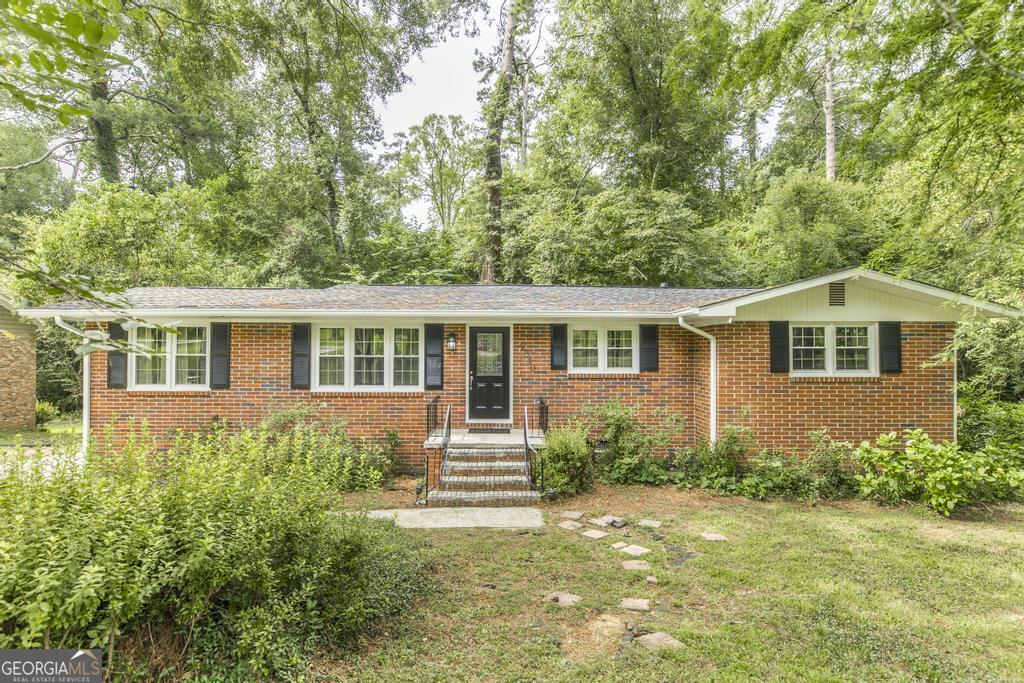 Looking for cute, cozy, strong, and affordable? This well-maintained all-brick 3 bedroom, 2 bathroom home has everything you need and more. Located in a highly sought-after area near schools, shopping, and everyday conveniences, it offers a warm and inviting feel the moment you walk in. Beautiful hardwood floors welcome you into the spacious living room, leading into a large separate dining area that's perfect for family gatherings or entertaining guests. The layout is both functional and comfortable, with generous room sizes and a natural flow throughout. Priced to sell, this gem won't last long-schedule your showing today!