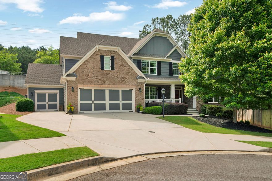 Welcome to your dream home nestled in a  cul-de-sac just steps from the scenic Kennesaw Mountain National Battlefield Park. This stunning 4-bedroom, 3.5-bathroom residence offers the perfect blend of luxury, comfort, and convenience-located just minutes from Marietta Square, top-rated schools, shopping, and key commuter routes including Barrett Parkway, Dallas Highway, Cobb Parkway, and I-75.  Step inside to an open-concept floor plan with updated floors on the main level and abundant natural light throughout. The freshly painted exterior and inviting curb appeal welcome you home, while inside, the heart of the home is a gourmet kitchen that's built for gathering-featuring a massive island, granite countertops, stainless steel appliances, large pantry, and direct flow into the cozy family room with a stone fireplace, custom built ins and elegant coffered ceiling.    The primary suite on the main level offers a peaceful retreat with a walk-in closet, spa-style bath with double vanities, a garden tub, and a tiled walk-in shower.    Need space for hobbies, entertaining, or guests? You'll love the dedicated home theatre, three-car garage, and ample indoor/outdoor areas ideal for hosting. Whether you're relaxing on the patio or enjoying movie night, this home truly has it all.
