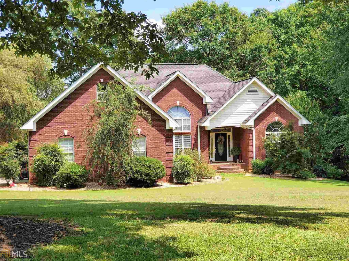 Brick ranch on full daylight basement in Oak Ridge Subdivision. Four Sides Brick - Heavy trim package throughout this beautiful home. Fireside great room is inviting and is open to the formal dining area with large palladium window. Kitchen comes complete with custom cabinetry, solid surface counters and an eat-in breakfast area with bay window. Desirable split bedroom floor plan. The full basement has drive under garage door. The home sits on a beautifully landscaped corner lot with over an acre of land.