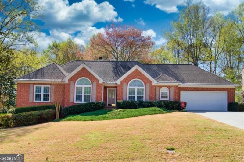Beautiful Ranch home nestled in the cozy Suwanee subdivision of Falcon Creek. Updated kitchen with stainless steel appliances and a centry kitchen feel with the perfect view of the private back yard. Spacious closets, 3 large full bathrooms on the main floor and a basement ready for entertaining. Basement area is complete with garage door that opens up to your private work area or storage. This home is a must see with a perfect location and short drive to downtown square.
