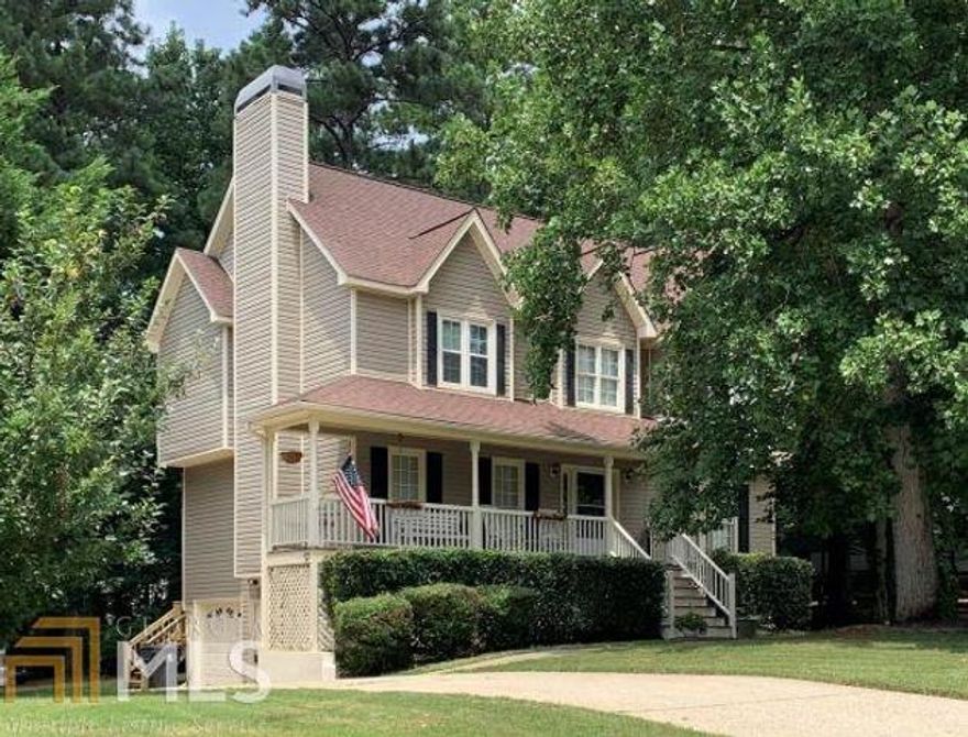MULTIPLE OFFERS RECEIVED. HIGHEST & BEST DUE 10/8 10AM.  Price Improvement! Great Cape Cod Home, in Paulding county, with a rocking chair front porch in an established community. 2000 square foot home has 3 bedrooms and 2 1/2 baths. Brick fireplace in living room, along with built in shelves. Large kitchen - floors redone - has great cabinet storage and an additional eat-in-kitchen area that overlooks the back deck (deck recently redone). Formal dining room.  All bedrooms are on the 2nd floor.  The over sized master with trey ceilings has a sitting area for a reading nook or desk. Spacious master bathroom has vaulted ceilings with his & her vanities. Additional bedrooms are on a split bedroom floor plan with a full bathroom on the 2nd floor.  Partial basement has another finished room - great for an office, craft room or man cave. Tons of storage throughout this home.   Large front lawn & private back yard are on a level lot.  Newer roof & upstairs AC unit. Freshly painted exterior, some interior rooms. Refrigerator, washer & dryer all remain. No HOA.
