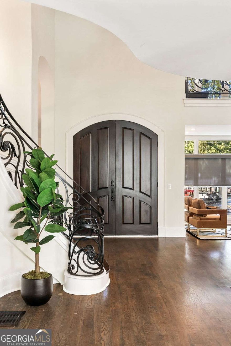 Step inside this 10,000+ sq ft gated masterpiece in the heart of Buckhead and experience Atlanta luxury at its finest. Every detail exudes sophistication - from the marble-clad interiors to the indoor pool oasis that defines resort-style living.    Designed for grand entertaining, the home features a chef's kitchen with an oversized island, a poolside full bar, and an intimate theater room. The main-level primary suite is a private retreat with pool views, dual marble baths, and boutique-style closets.    Multiple balconies and patios invite seamless indoor-outdoor living, while 4 garage bays, ample guest parking, and comprehensive surveillance deliver comfort and peace of mind.    This isn't just a home - it's a lifestyle of elegance, privacy, and prestige in Atlanta's most coveted neighborhood.