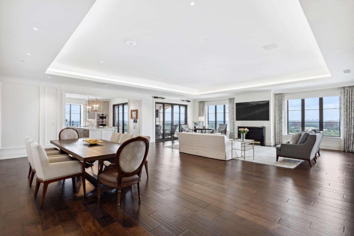 BEST BUY IN THE BUILDING! Prepare to be wowed when you step from the private elevator into the welcoming foyer of this NEWLY RENOVATED, stunning abode with unobstructed, unparalleled, spectacular views. Boasting 11' ceilings throughout, this sophisticated unit offers the finest in finishes and an airy open floor plan. The Living/Great Room has cove lighting, an inviting fireplace and is open to a gracious size Dining Area with wonderful walls to showcase art. It flows to the state of the art Kitchen from Artistic Cabinetry and Design with quartzite counters, island with seating, SubZero fridge, paneled cabinet appliances, Dacor microwave, Wolf range (6 gas burners and grill), Wolf double wall ovens, Bosch dishwasher, stainless deep sink, lots of pullout racks in cabinets and a breathtaking view from Kitchen window, all opening up to the wonderful covered Balcony with fireplace, TV and outdoor gas grill. The stylish wet bar boasts stone counters, 2 SubZero refrigerated drawers, beverage/wine fridge, ice maker and sink. The 2nd Bedroom features a cleverly designed Murphy Bed, plenty of storage, drawers, hanging space, TV and, when not in use for sleeping, it's a handsome Office or Den. The adjoining marble Bathroom features a beautiful vanity and a large walk-in shower with built-in bench. The elegant oversized Primary Suite features a gorgeous marble Bathroom with double vanities, soaking tub, large walk-in shower with bench, private Toto commode, large linen closet and a massive custom closet with huge island, cabinets, dressing area and plenty of hanging and shoe space. It leads into a tucked away private office. The large Laundry Room has marble counters, sink, cabinetry and accommodates full size appliances. Finally, the secluded back Service room with another private elevator, (this is where the Concierge service discretely delivers your dry cleaning and packages!) has a great Pantry, loads of cabinets with storage and drawers, AV and Crestron Automation equipment. There are gorgeous wide plank hardwood floors throughout all living/sleeping areas, a coveted private, deeded 2 car garage (only 26!), large climate controlled storage room, access to world-class amenities of the pool, full service spa, fitness center, restaurants - the fabulous Atlas, the St. Regis Bar and the Garden Room - 24 hour room service, and a dedicated award winning concierge service. Atlanta's finest shopping and dining district is just steps away. Living at the St. Regis is as good as it gets for those who deserve nothing but the best. This residence is the epitome of luxury and exceptional living, offering space, floor to ceiling windows, views from all rooms and an enviable lifestyle waiting to make it yours. Lowest Price in the Building!