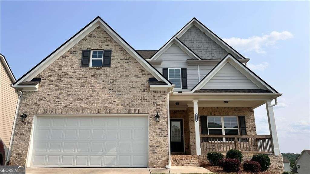 Welcome to this move-in ready 5-bedroom, 3-bathroom home in the desirable Overlook at Hamilton Mill community! Built in 2023, this spacious residence offers a modern open layout with one bedroom and full bath on the main level-perfect for guests or a home office. The stunning kitchen features stained cabinets, a gas cooktop, dishwasher, disposal, and opens to the breakfast area and oversized family room. Upstairs, the generous master suite is accompanied by three additional bedrooms, another full bath, and a convenient laundry room. Enjoy hardwood floors, crown molding, and a full unfinished daylight basement offering ample storage or future living space. Community amenities include a swimming pool, park, and proximity to shopping, trails, and top-rated schools like Mill Creek High. Located just minutes from I-85, this home combines comfort, space, and convenience in a beautiful setting.