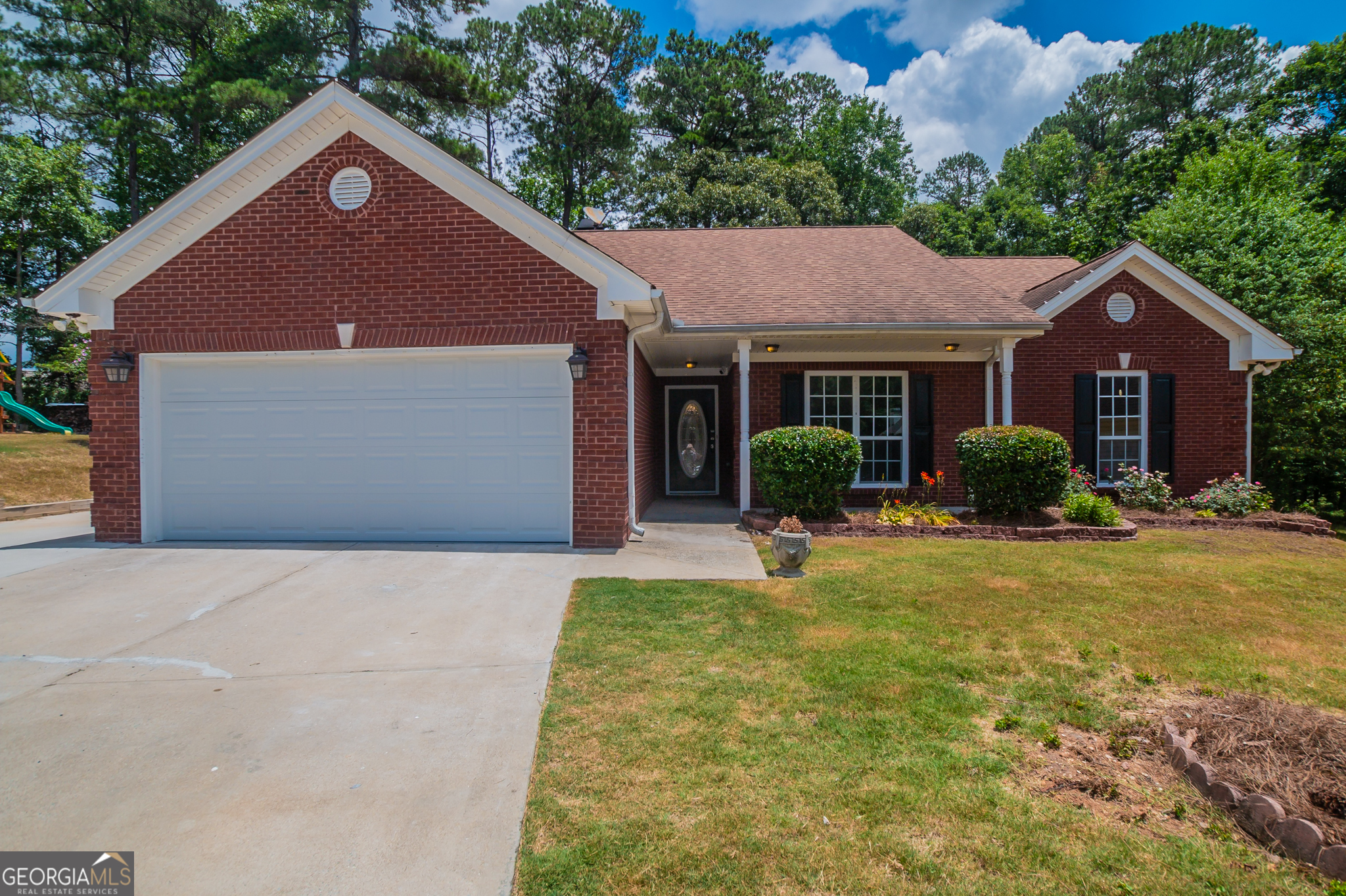 Welcome to 2672 Freemans Walk Path, Dacula! This delightful 4-sided brick ranch home is perfectly situated in a cul-de-sac, offering privacy and tranquility. As you approach, you'll be greeted by a charming covered front porch. Inside, the family room boasts a vaulted ceiling, a cozy fireplace, and built-ins for added convenience. The kitchen is a chef's dream, featuring white cabinets, granite counters, a tiled backsplash, and stainless-steel appliances. A versatile flex room provides additional space for a home office, playroom or formal living room. The primary bedroom offers a tray ceiling, a walk-in closet, and a bath with a double vanity, separate tub, and shower. Step outside to the covered patio and deck, perfect for outdoor entertaining. The backyard also includes a playhouse, a workshop, and a storage shed but the seller will remove these items before closing if the buyer prefers. Located near Dacula high school, shopping, restaurants, and Dacula Park, this home is convenient to Hwy 316 and Sugarloaf Parkway. Don't miss this exceptional property in a fantastic location!