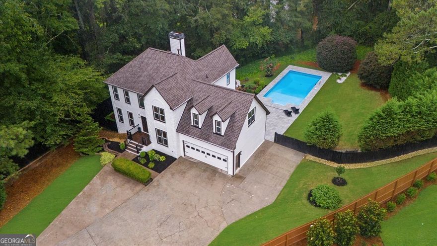 Fresh Renovated Smart Home in Prime Alpharetta Location. Presenting a stunning 6-bedroom, 4.5-bathroom home with the perfect combination of luxury, technology, and convenience-just minutes from downtown Alpharetta and Avalon in a top-rated school district. Nestled in a quiet cul-de-sac on a spacious 2/3-acre lot, the property features a private oasis offering an inground pool, serene pond with waterfall, and ample space for outdoor enjoyment including a playground for the kids. The pool has new beautiful large pavers extending to a great entertainment area for lounging and outside dining. This home is truly like a new home with a well thought comprehensive renovation.  Inside, you'll find a freshly remodeled interior with an open modern layout and top-quality finishes. The smart home system connects to Wi-Fi and controls smart light switches, exterior wall lighting, kitchen appliances, thermostats, a whole-home generator for peace of mind, and pool water quality monitoring-all from the convenience of your phone. If you want a home that has most everything this is your home. Walking through the doors you will notice the beautiful hardwood floors, new lighting, hardware, quartz countertops with beautiful quartz waterfall counter, and so much more. The home has had exemplary care providing new paint inside and out, newer windows, new roof, transferable termite letter, new AC Heat pumps. The in-law suite on the terrace level offers 2 bedrooms with ensuite full baths, laundry room, kitchenette and outside entrance. Large parking pad can accommodate an RV/Boat. Extra large workshop with heat and air. A separate storage shed for your pool toys. This is more than a home-it's a lifestyle of comfort, security, and smart living in one of Alpharetta's most desirable areas.