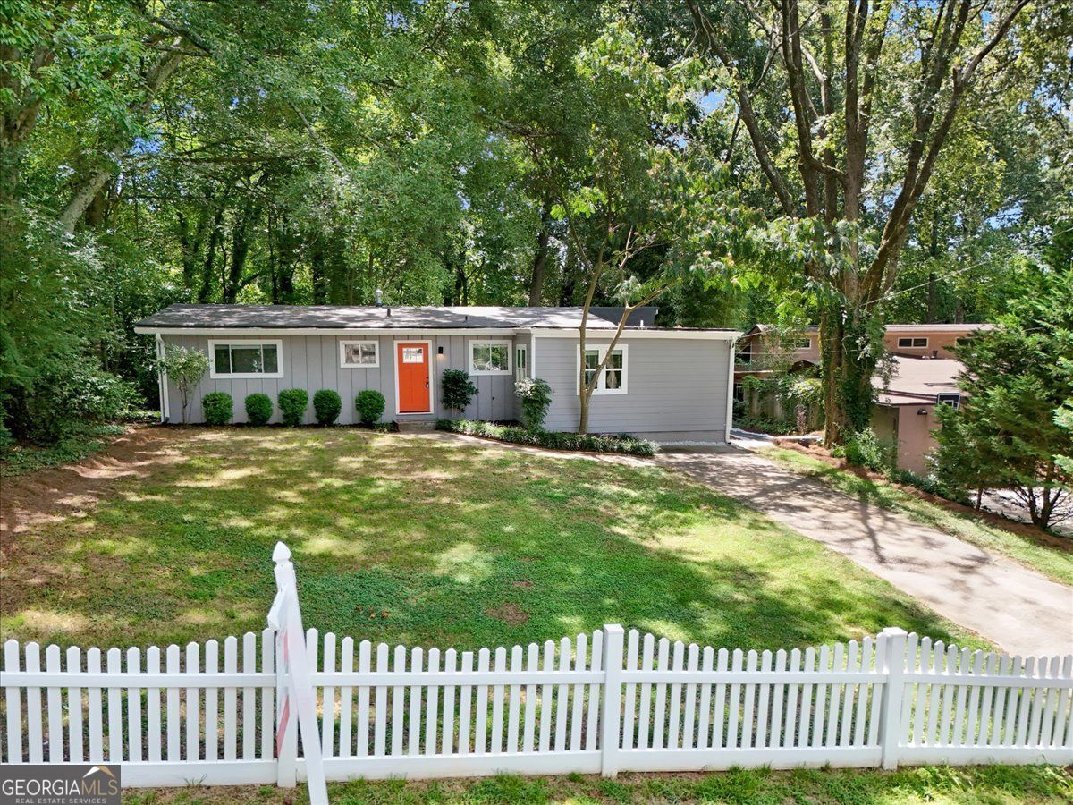 Tucked on a quiet street in Brookhaven's sought-after Drew Valley neighborhood near Ashford Park Elementary, this fully renovated mid-century gem blends timeless charm with modern comfort, and a lifestyle you'll love coming home to. Step inside to soaring vaulted ceilings, sparkling hardwood floors (refinished April 2024), and a bright, open living space designed for connection. The completely new kitchen (2023) features shaker cabinets, quartz countertops, and stainless steel appliances, flowing effortlessly into a spacious living area with glass french doors to the private deck - perfect for weekend gatherings, grilling with friends, or simply enjoying the outdoors. The primary suite is a serene retreat with a double vanity, soaking tub, and separate shower, while three additional bedrooms and a stylish full bath are tucked on the other side of the home, offering both privacy and function. Outside, a fully fenced backyard is ideal for pets and play, complete with a white picket fence in front that adds curb appeal and charm. Wave to neighbors walking by or toss a ball in the front yard under the trees; it's that kind of street. Enjoy peace of mind with a fully encapsulated crawl space (2024), electrical updates (2024), and reinforced decking (2024) already in place. All just minutes from Briarwood Park, Skyland Park, Brookhaven Farmers Market, and the shops and dining along Dresden Drive and Town Brookhaven - with easy access to Buckhead, I-85, and all the perks of intown living. No HOA. This one has the location, the updates, and the feel-good lifestyle to match. Come see it in person and picture your life here.