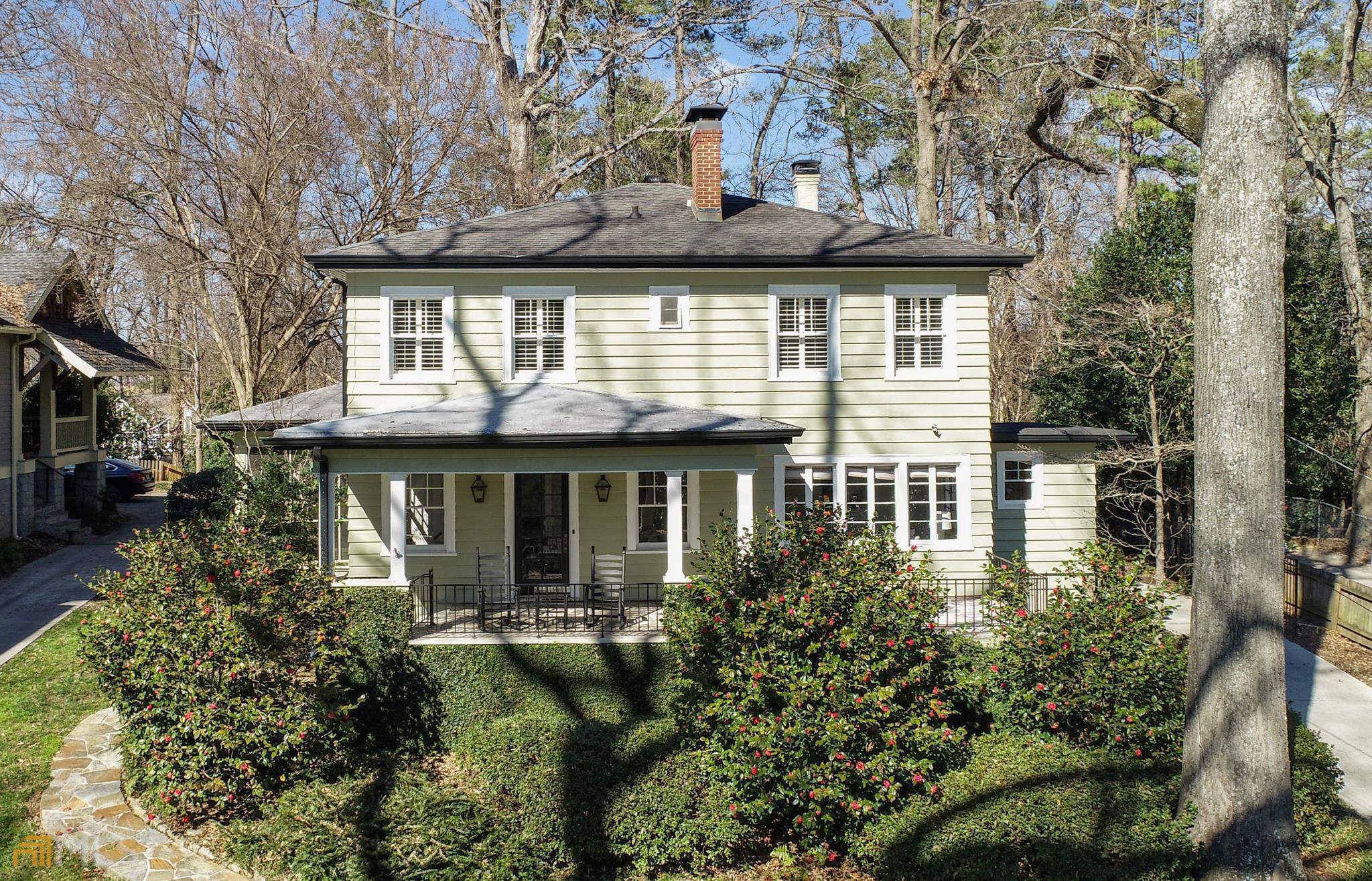 Historic charm abounds in this updated 1927 Craftsman home in a prime Collier Hills location! A huge stone-inlaid covered front porch welcomes you into the formal living room with fireplace and cozy family room, enhanced by the homeCOs beautiful southern exposure. All marble floors on the main level with original windows, including casement windows, original interior doors, wood trim, and high ceilings show off its early 20th century character. New 6 burner BlueStar Pro-style Range with Zephyr Hood and Bosch Dishwasher in the kitchen with restored slate flooring. Elegant dining room opens to an inviting screened side porch, leading to a sunny stone courtyard. Four bedrooms with plantation shutters and newly refinished hardwood upstairs. 4th bedroom currently configured as an oversized closet that can be easily converted back. All marble main bath with a second fully renovated Jack and Jill bath. Laundry room is newly customized to include a mud room and stackable W/D connections. Across the courtyard is a detached, renovated and rentable CARRIAGE HOUSE, apartment sized with a full kitchen, two bedrooms, a full bath and a newly rebuilt private rear deck. The kitchen was upgraded with a Samsung range and Pro-style hood. A custom-built island and separate laundry cabinet have been added, with the Samsung W/D included. Whole new HVAC system in 2020. Main house and Carriage house are both freshly painted. Large flat parking area at top of driveway with a gate. Front porch overlooks Tanyard Creek Park and Urban Forest across the street and the Northside Beltline Trail is just two houses away! The Bobby Jones Golf Course and Bitsy Grant Tennis Center are just around the corner.