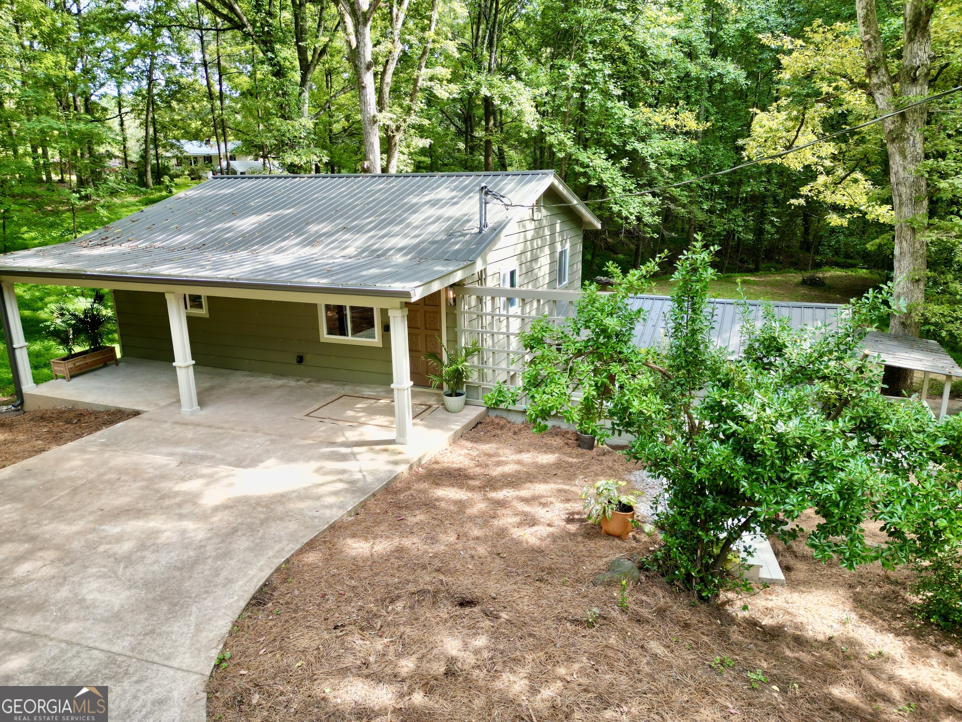Discover this pristine 4 bed, 2 bath home on 1 acre at 2798 Riverbend Rd. Featuring two separate living spaces-each with 2 bedrooms, 1 bath, and a full kitchen-this property is ideal for a private teenager suite, in-law suite, or savvy investor seeking rental income to offset the mortgage. Everything is brand new, including plumbing, electrical, HVAC, water heaters, and finishes. Meticulously designed, impeccable attention to detail. Come see for yourself. Perfectly located less than 5 minutes to the Chattahoochee River and under 15 minutes to the scenic North Georgia mountains. A turnkey home with endless possibilities!