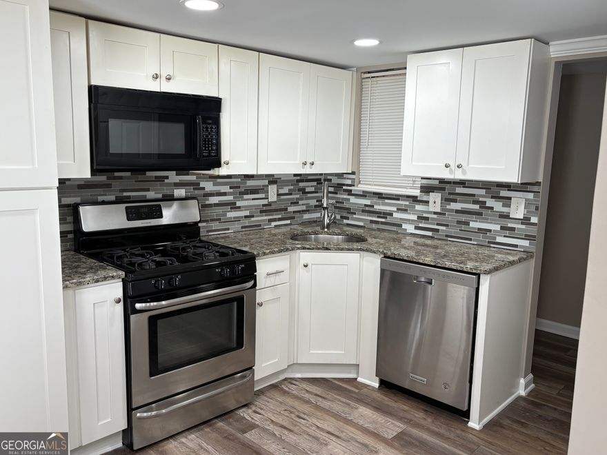 Updated bottom floor condo, located in the desired  Marietta area, close to shopping, restaurants, parks, Battery park-home of the Atlanta Braves. This property has new paint and new LVP floor, updated kitchen with large pantry area, fireplace, breakfast bar area,  sunroom, deck.   Property includes washer/dryer as part of the annual lease. Security deposit and background checks required. No pets. Lease includes water and trash service. Tenant pays gas ,electric and WIFI-Cable