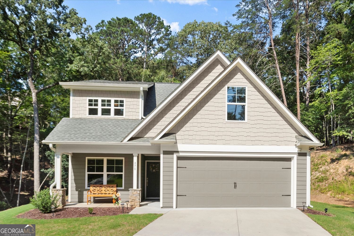 Modern Craftsman Charm in the Heart of Lake Arrowhead. Welcome to this beautifully crafted 4 bedroom, 3 bathroom home, built in 2022 and perfectly situated on a mostly level, oversized lot with private wooded views. Located in the sought-after Lake Arrowhead community in Waleska, GA, this home offers the perfect blend of peaceful nature and upscale amenities. Inside, you'll find luxury vinyl flooring throughout the entire home, including all bedrooms, offering both elegance and durability. The spacious, open-concept layout features a large living room, dining area, and a modern kitchen designed for both everyday living and entertaining. The kitchen features sleek finishes, ample cabinetry, and an oversized walk-in pantry with plenty of storage space. The primary suite is located on the main level and provides a peaceful retreat with a luxurious en suite bathroom, double sinks, and a large walk-in closet. Additional bedrooms on the main and second levels of the home. A sprinkler system has been installed to keep your lawn and landscaping in top condition with ease. The private wooded backyard offers a peaceful setting for relaxation or entertaining guests. Life in Lake Arrowhead offers more than just a beautiful home. It's a lifestyle. At the heart of the community is a pristine 540-acre mountain lake with over 20 miles of shoreline. Fed by clear mountain streams, the lake is perfect for boating, fishing, swimming, and lakeside picnics at the marina's Lakeside Park. Miles of scenic hiking and nature trails surround the area, allowing residents to explore the beauty of the North Georgia mountains. Golfers will enjoy The Highlands, an 18-hole championship golf course consistently ranked among the best in Georgia. Additional amenities include community swimming pools, tennis and pickleball courts, a clubhouse, fitness center, and year-round community events designed to bring neighbors together. Don't miss this opportunity to live in one of Cherokee County's premier lake and golf communities.