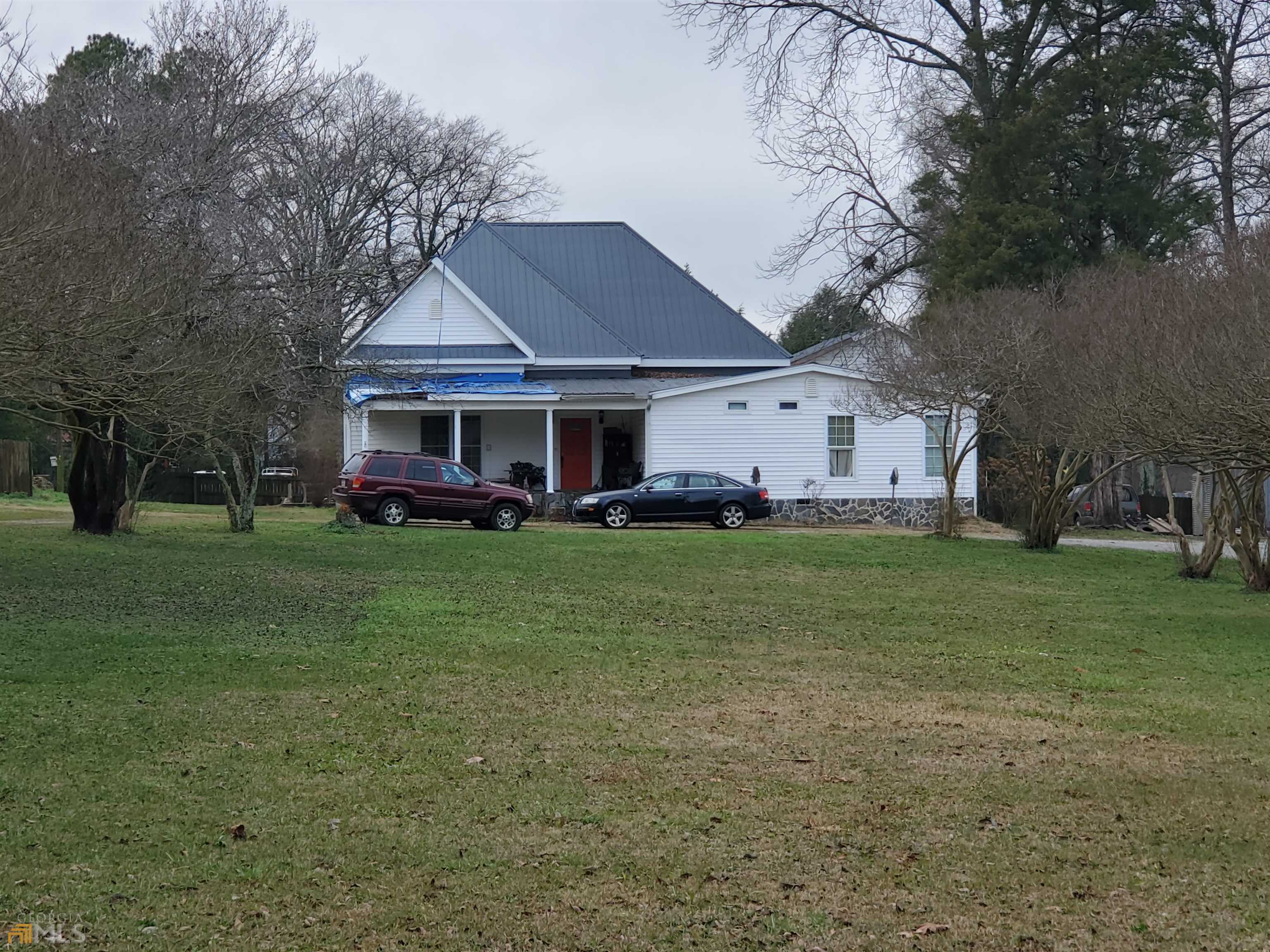 Large home in Aragon Village. This house has beautiful hard wood floors, large open kitchen area, 3 bedrooms and 3 baths on the main level plus a 1 bed /1 ba loft above the large garage. This house needs a little TLC to bring it back to the grand house it was. Being sold AS-IS.