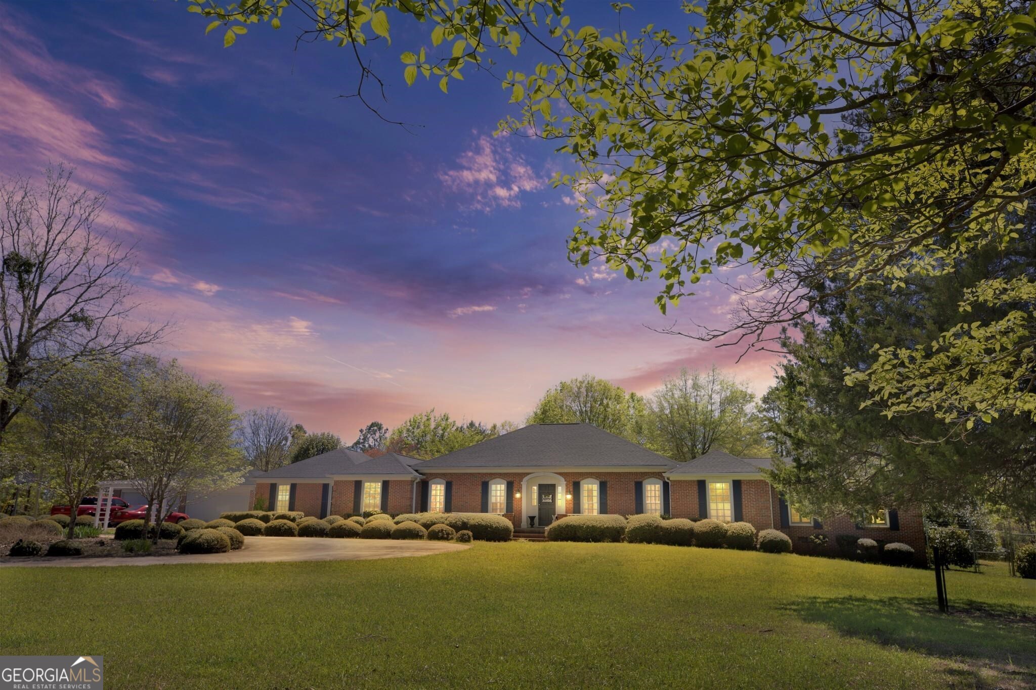 Don't miss out on this one of a kind estate home with everything you could possibly desire. There are formal gardens where something is always blooming, multiple outdoor entertaining spaces, along with numerous indoor spaces that offer optimum recreation, entertainment, or relaxation options. Step inside and you'll notice hardwood and tile floors throughout. The newly remodeled kitchen will wow you with it's quartz countertops, custom cabinetry, breakfast bar and stainless appliances. Steps off the kitchen you'll find a nice dining room, a formal, sunken living room, and a family room with fireplace. You'll want to stay awhile in the recreation room for a family game of billiards or to watch your favorite team battle it out. Steps off the foyer is a hall that leads to 4 Bedrooms, two that share a Jack-n-Jill bath, along with another oversized bedroom with it's own bath. Further down the hall you'll come to the spacious primary suite with three walk-in closets, a huge primary bath with separate shower and soaking tub. Just off the family room you'll be enthralled to find a comfortable bedroom suite that includes a spa quality bath with separate shower, and a sitting room with it's own fireplace. A four car garage is detached but has a covered breezeway walk to the home. Also included outdoors you'll find two covered patios, a gazebo, and tucked away from the home is a workshop with a full-sized garage door. Roof on home and garage less than two years old, two of three HVAC units are new. Home is located on 4.996 acres of first parcel, which will be conveyed with a non adjoining second parcel of .152 acres that contains a deep artesian well. This home truly has it all and is located minutes from city conveniences. Call your favorite realtor today to arrange your private tour.