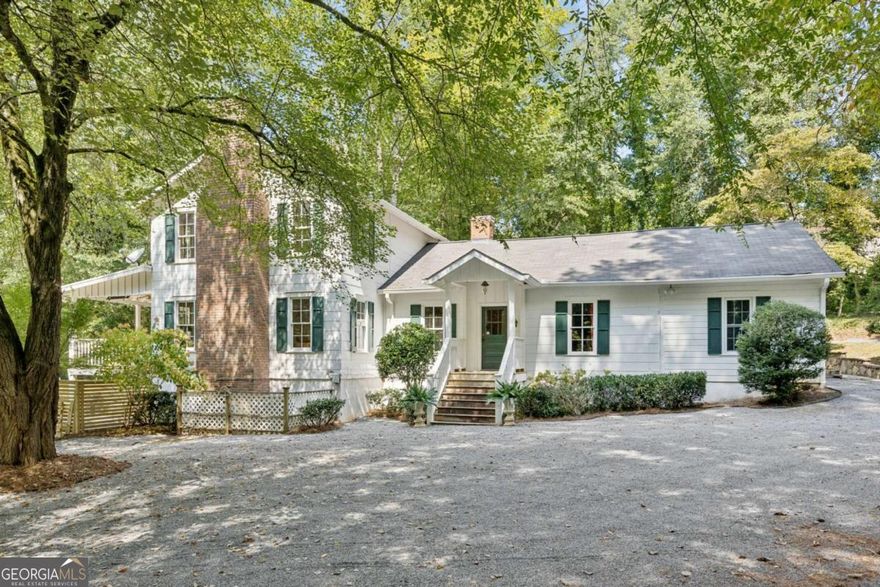 Rare 11-Acre Equestrian Retreat in East Cobb! Welcome to 4019 Wesley Chapel Road - a private estate offering 11 acres of unmatched serenity and possibility. Tucked away in one of East Cobb's most desirable locations, this former equestrian property is a true hidden gem, blending timeless charm with boundless potential. The residence is filled with character and warmth. A light-filled kitchen anchors the home with custom cabinetry, double ovens, an oversized island with cooktop, and abundant prep space. Multiple gathering rooms, each with inviting natural light and hardwood floors, provide perfect backdrops for both casual living and elegant entertaining. The bathrooms are spacious, offering classic finishes and the opportunity for personalization. Step outside and experience the lifestyle most only dream of. A sparkling pool, framed by a new privacy fence and surrounded by mature woodlands, invites you to unwind in total seclusion. For equestrian lovers, the estate's heritage is unmistakable. Multiple barns with stalls, fenced paddocks, and turnout areas are thoughtfully laid out across the grounds, ready to be restored to working order. With gently rolling acreage and tree-lined borders, the setting is both functional and breathtakingly beautiful. Here, you'll find the perfect balance: a private retreat surrounded by nature, yet minutes from top-rated schools, shopping, dining, and major highways. Whether you envision reviving it as a premier horse property, crafting a luxury family compound, or pursuing development opportunities, 4019 Wesley Chapel Road offers a canvas unlike any other.