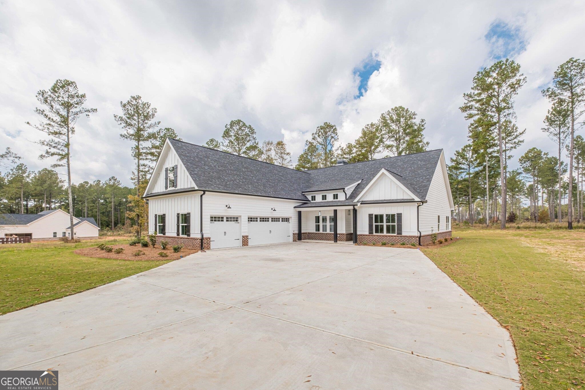New Construction Craftsman Style Ranch Home On 2+- Acres- NO HOA! Beautiful Curb Appeal! This Home Features -Covered Front porch & Covered Rear Patio-3 Car Garage-Board and Batten Front Elevation-Brick Water table-Interior Features Laminate Flooring in the Foyer, Dining Room, Living Room, Office Kitchen, Laundry Room and Breakfast Area! 4 Bedrooms 3 Full Baths! Open Floor Plan Great for Entertaining-Family Room w/Brick Fireplace-Owner Suite with Tray Ceiling-Resort Style Bath with Tile Shower w/Custom Shower door & Tile Flooring-Double Vanity-Beautiful Kitchen-White Cabinets-Granite C-tops & Tile Backsplash-Breakfast Area-Pantry-Dining Room with Custom Trim-Large Secondary Rooms-Upstairs 4th Bedroom has Full Bath-Laundry Room on Main with Cabinets!