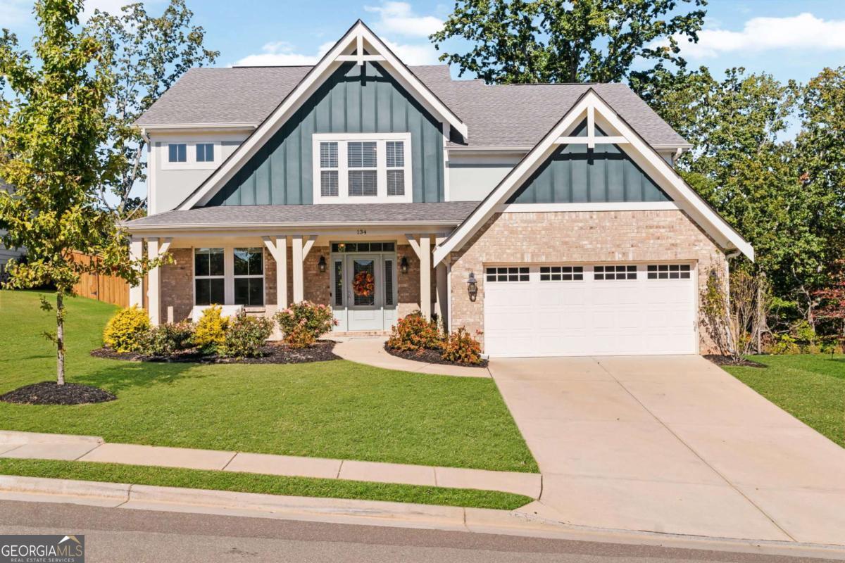 Welcome to 134 Greenbrier Way, nestled in the highly sought-after Great Sky subdivision in Canton, Georgia. This beautifully maintained home offers four oversized bedrooms, an open-concept layout, and sweeping views of the North Georgia Mountains-all in a vibrant, amenity-rich community. Step inside to a stunning two-story great room filled with natural light, where soaring ceilings and a wall of windows frame the manicured backyard. The open floor plan flows effortlessly into a well-appointed kitchen, complete with a large island that's ideal for your morning coffee, casual dining, or entertaining friends. On the lower level, you'll find one of the home's standout features: a media room perfect for football Sundays, movie nights, or binging your favorite Netflix series. Upstairs, all four bedrooms offer generous space, great closets, and thoughtful layouts-ideal for both rest and functionality. Living in Great Sky means more than just a beautiful home-it means community. Enjoy resort-style amenities including multiple swimming pools, a splash play area, playgrounds, tennis courts, pickleball courts, and miles of scenic hiking trails. Located just minutes from the new Cherokee High School and the shops, dining, and events in downtown Canton, this location offers both convenience and connection. Whether you're enjoying the view, entertaining on the main level, or exploring the trails nearby, this home gives you the lifestyle you've been looking for.