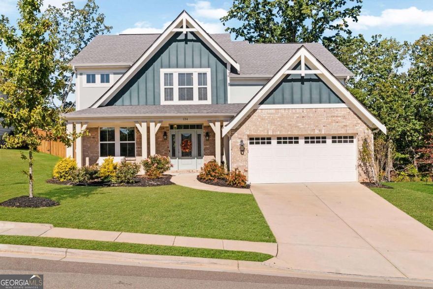 Welcome to 134 Greenbrier Way, nestled in the highly sought-after Great Sky subdivision in Canton, Georgia. This beautifully maintained home offers four oversized bedrooms, an open-concept layout, and sweeping views of the North Georgia Mountains-all in a vibrant, amenity-rich community.    Step inside to a stunning two-story great room filled with natural light, where soaring ceilings and a wall of windows frame the manicured backyard. The open floor plan flows effortlessly into a well-appointed kitchen, complete with a large island that's ideal for your morning coffee, casual dining, or entertaining friends.    On the lower level, you'll find one of the home's standout features: a media room perfect for football Sundays, movie nights, or binging your favorite Netflix series. Upstairs, all four bedrooms offer generous space, great closets, and thoughtful layouts-ideal for both rest and functionality.    Living in Great Sky means more than just a beautiful home-it means community. Enjoy resort-style amenities including multiple swimming pools, a splash play area, playgrounds, tennis courts, pickleball courts, and miles of scenic hiking trails. Located just minutes from the new Cherokee High School and the shops, dining, and events in downtown Canton, this location offers both convenience and connection.    Whether you're enjoying the view, entertaining on the main level, or exploring the trails nearby, this home gives you the lifestyle you've been looking for.