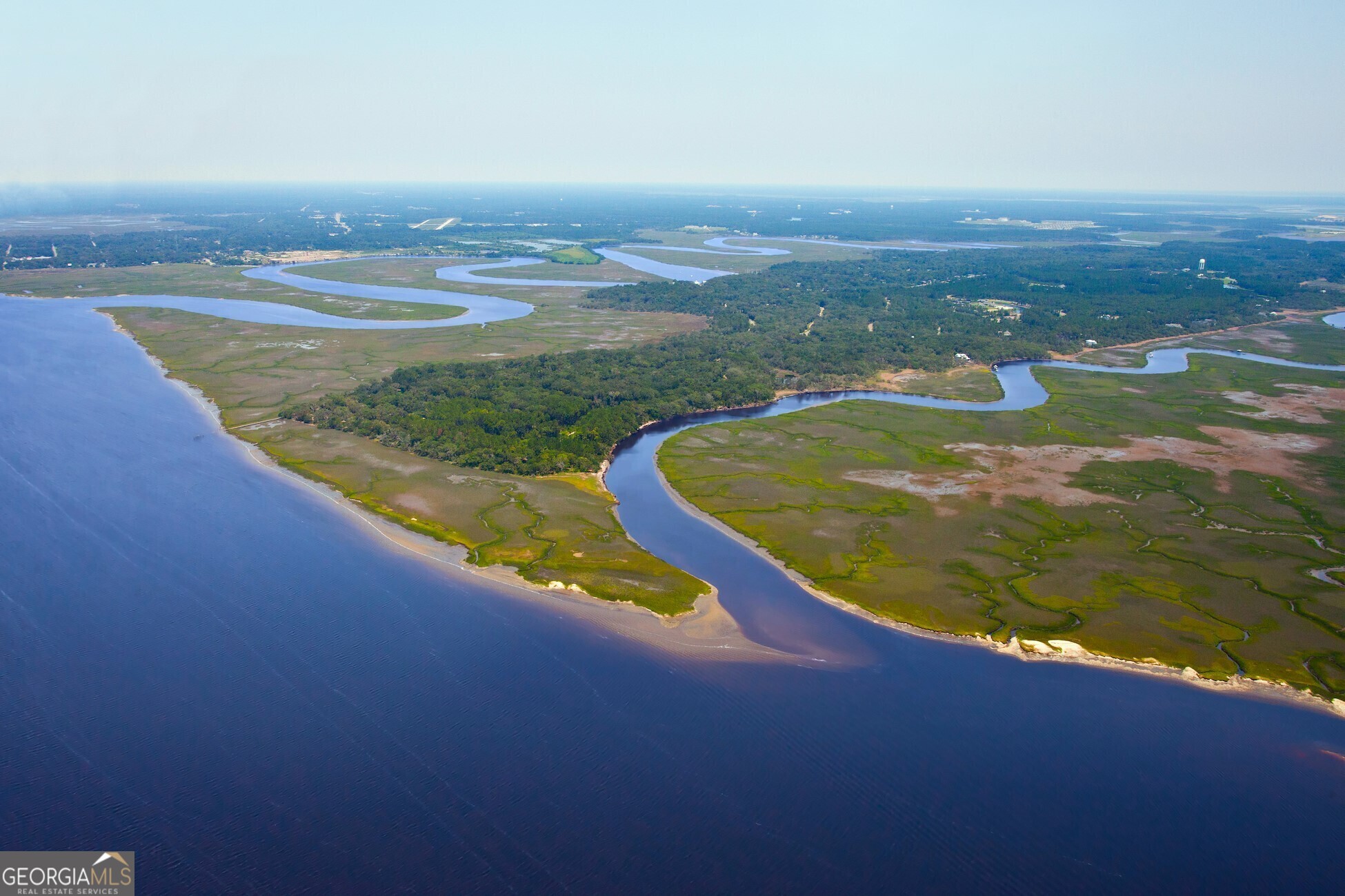 Quaint and quiet waterfront community? CHECK! Low-country coastal neighborhood? CHECK! So many amenities that you scarcely need to leave the neighborhood? CHECK! You finally found it! Welcome to Cumberland Harbor! This homesite is prefect for those looking for a little extra privacy. It is situated on a corner in a small cul-de-sac with a limited number of homes. Depending on your home design, you have multiple options in terms of entry points to the garage and overall design layout. The property has many trees and a nice 50-foot buffer in the rear, adding to its privacy. The location is also prime because it is an easy walk to a long list of amenities covered under your low POA fee. These include the swimming pools, tennis courts, pickleball courts, fitness center, multiple playgrounds and parks. The property also has access to South Point Park for fishing or watching the sunrise over Cumberland Island. You can also enjoy miles of nature trails, a community dock with a kayak launch, take a short boat ride to Cumberland Island or the Fernandina marina. This community has all the beauty and privacy you desire yet less than forty-five minutes to the Jacksonville International Airport or city shopping. Cumberland Harbour has remained true to the low-country Southern home style with front porches for sweet tea and moss-draped live oaks for plenty of summer shade. The current owner had a lovely home designed for this site and are willing to share its complete plans with a new owner. Alternatively, you can work with one of the twelve approved custom home builders to create your own slice of heaven. These designs must be submitted and approved by the Design Review Board. As part of our services, we can help you work together with one of the approved builders to prepare the proper design. As always, all home plans must be reviewed and approved by the design review board. Schedule your tour of Cumberland Harbour and this beautiful building site today.