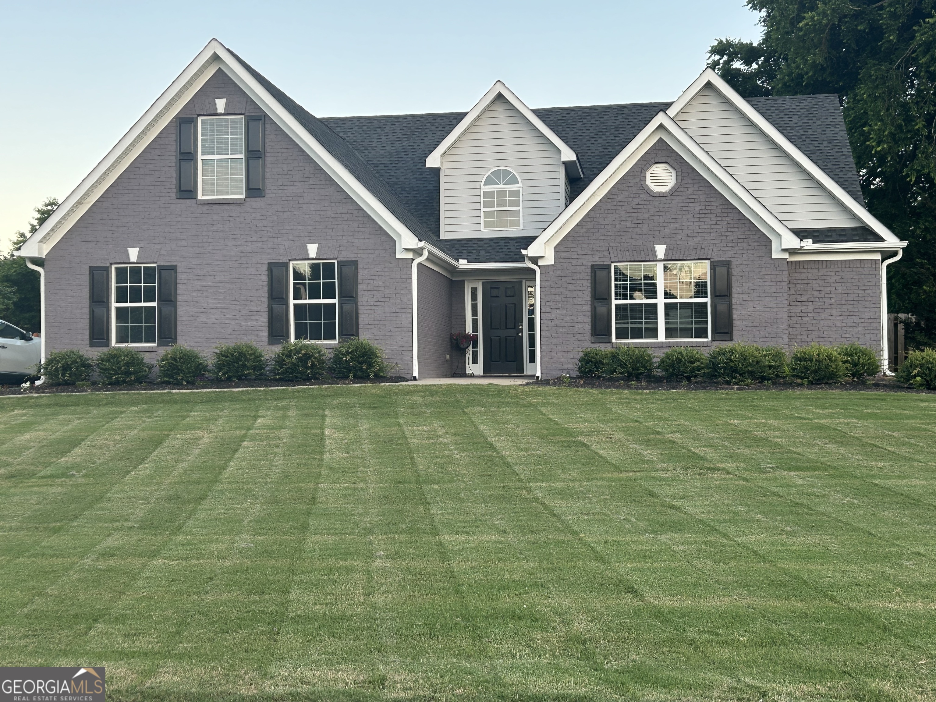 LAKE LIVING DREAM - DON'T MISS THIS GEM! 4 Bed/3.5 Bath/Water Oaks at Lake Oconee. This is the opportunity everyone's been waiting for - and the one you don't want to miss. Nestled in the prestigious Water Oaks subdivision on Lake Oconee, this charming 4-bedroom, 3.5-bath home is the perfect blend of relaxed luxury and everyday comfort. Whether you're retiring from Atlanta or relocating from across the country in search of lake life serenity, this immaculately renovated and well maintained home offers the lifestyle you've been dreaming about. Lake Access Just 2 Minutes from Your Door! This is more than just a home - it's a gateway to the lake life. Enjoy the use of the marina and boat launch, plus a dry boat storage facility just around the corner. You can go from your garage to the water in minutes - no hauling, no hassle, just endless weekends on the lake. Property Highlights: *Lake views from your front yard, and a beautifully landscaped backyard with privacy fence, lots of room to play, a fire pit, and a back porch for quiet evenings or entertaining under the stars. *Vaulted ceilings in main foyer, living room and owner's suite. A cozy fireplace, and natural light fill the spacious living room. *Oversized owner's suite with spa-like custom bath featuring soaker tub, tiled walk-in custom shower, custom cabinetry and granite countertops. The walk-in closet features custom cabinetry as well. *Modern kitchen with all new custom cabinets, granite countertops, oversized kitchen island, added floor to ceiling pantry area, beverage station and high top area through to the living room (also with granite countertop and custom cabinets below for storage) allows for an extra seating area for dining, entertainment and added guests. *Guest bedrooms with Jack and Jill bath and a large 4th bedroom upstairs with a private bath. *Wainscoted dining room perfect for family dinners or entertaining. The Best of Lake Oconee Living - Located in the heart of it all. Water Oaks offers quiet, upscale community living just minutes from shopping, dining, golf and the Lake Oconee Academy. Whether you're into boating, fishing, golfing, or simply sipping your morning coffee while watching the deer pass by - this is your place! Why Wait for Retirement to Live Like You're on Vacation? Homes in Water Oaks don't last - this home is fully renovated with a 1 year home warranty included. This rare opportunity will sell quickly! Schedule your private showing today and make Lake Life your everyday life in the Lake Oconee area.