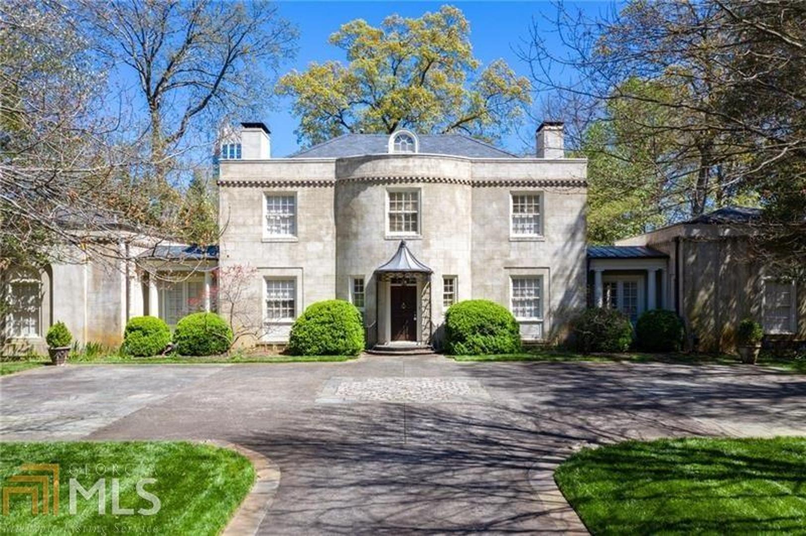 Gorgeous 1940's home on sought-after Vernon Road in Peachtree Heights West. Spacious entrance foyer leads to living room and sunroom, oversized master on main with dual baths. Light filled kitchen with granite counters, 6 burner range, eat-in kitchen. Separate dining room with wet bar. Charming staircase leads to 4 bedrooms and 2 shared baths. Truly breathtaking level backyard with pool and water feature. 4 car garage, 2 attached and 2 detached.