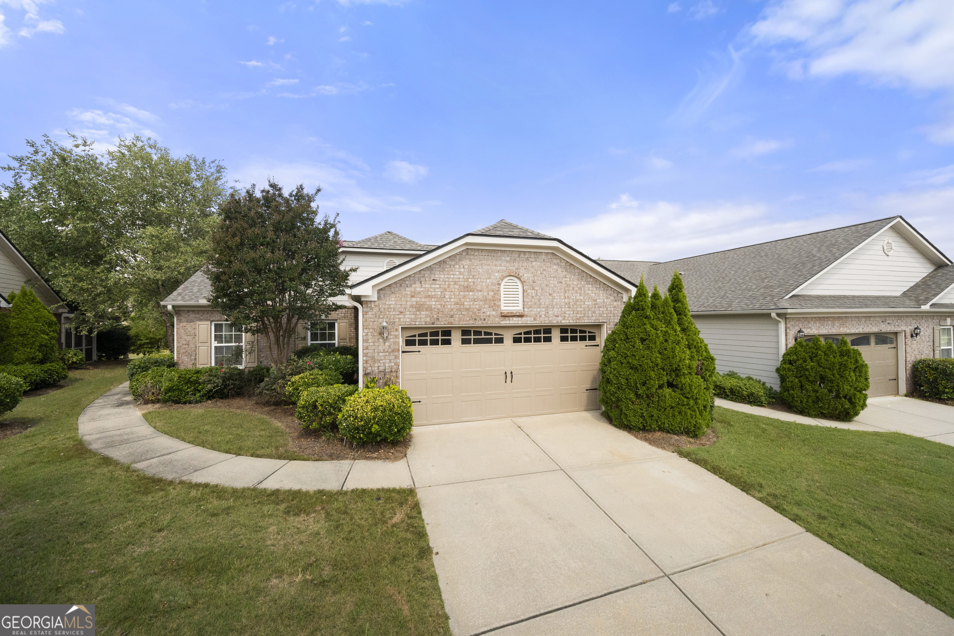 Maintenance-free living at it's finest! One level townhouse near the Mall of Georgia! Conveniently located just minutes from restaurants, shopping, and more! Step inside to soaring vaulted ceilings and an open, flowing layout. Gourmet kitchen with great counter space and ample cabinet storage. Clear views to the dining and living room make this home perfect for entertaining! Enjoy endless nights on the private screened-in porch, or grilling on the patio. This home has abundant storage throughout as well as amazing natural light! Generous primary suite with vaulted ceilings leads to primary bathroom complete with double vanity sinks, glass shower and walk in closet! Spacious secondary bedrooms; one with direct full bath access. Kitchen level 2-car garage with stepless home entry...schedule viewing and...MAKE IT HOME!
