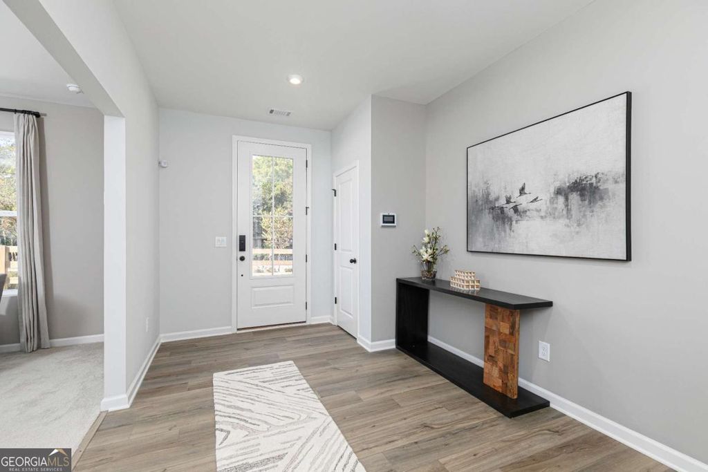 Photo of 3495 Tristens Cove Walk, Loganville, GA 30052 (MLS # 10741442)