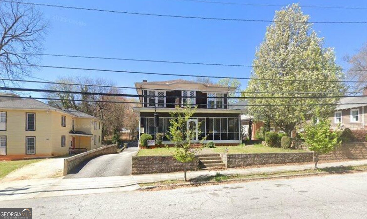 Discover the charm and potential of this historic 1920 home at 1008 State St NW, ideally located just minutes from Atlantic Station, Georgia Tech, the Georgia Aquarium, World of Coca-Cola, and Mercedes-Benz Stadium. This spacious property features four fireplaces, bedrooms on every level, a full basement, and outdoor living spaces, including a covered patio and a deck off the kitchen. With its character-filled design and prime location, this fixer-upper offers endless possibilities-restore it to its historic beauty, create your dream residence, or transform it into an income-producing rental perfect for students or shared living. Close to some of Atlanta's best shopping, dining, and hospitals, this home is truly a rare find in the heart of the city. This property will not last!
