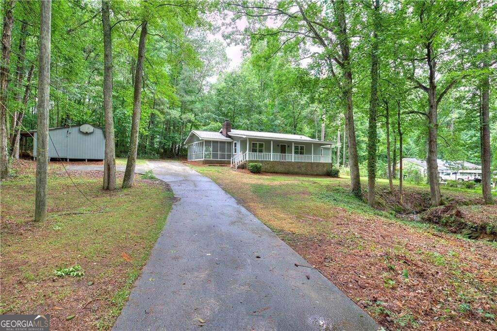 Imagine owning a home nestled by a tranquil creek. If this dream resonates with you, don't miss the opportunity to explore this meticulously renovated residence. Revel in the fresh allure of new flooring, a modern kitchen, upgraded fixtures, a state-of-the-art HVAC system, a brand-new roof, and numerous other enhancements. Additionally, benefit from the convenience of an on-site storage shed for extra space.
