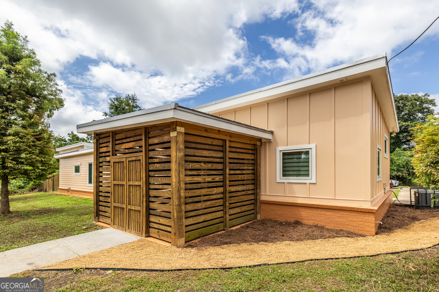 Very nice Commercial live/work space located in the popular Joyland neighborhood! Only .6 mi from the Beltline, this area is ready to benefit from all the Beltline has to offer. A +/- 1,677 SF building zoned C1, built in 2019, this property offers a 1BR/1BA living space with a large living/kitchen area plus 2 screened porches - a larger one for dining and lounging off the living/kitchen area, and a smaller, more intimate one off the bedroom (the bedroom, by the way, is spacious enough for a king bed!). A demising wall separates the commercial area which includes a large open work area, a screened area at the front entrance, plus a half-bath. The half bath in the commercial space was designed to be large enough to accommodate adding a shower stall to give the option of 2 separate apartments - a studio and the existing 1 bedroom - with the addition of a small kitchen in what's currently the commercial space. Some features of the property include a gas cook-top, refrigerator/freezer, dishwasher and a washer/dryer set. There are 2 climate-controlled zones - 1 for each side. The entire back yard is enclosed with a 6 ft privacy fence. Because there is a creek running through the adjacent rear lot, City of Atlanta required the installation of a detention pond, which was installed underground, thus saving the backyard space. There are 5 parking spaces, including 1 HC space. Hurricane strength glass in all the windows and doors, provide additional insulation and protection from the elements! All of the staging tables and bed can remain with the sale or be removed prior to closing as the Buyer wishes. Hardi-plank siding plus a metal roof make this a very sturdy and attractive location for your Buyer looking for a live/work space. Property has been completely repainted inside and out, professionally cleaned and is move-in ready. Property is being sold "AS IS-WHERE IS" with the right to inspect.