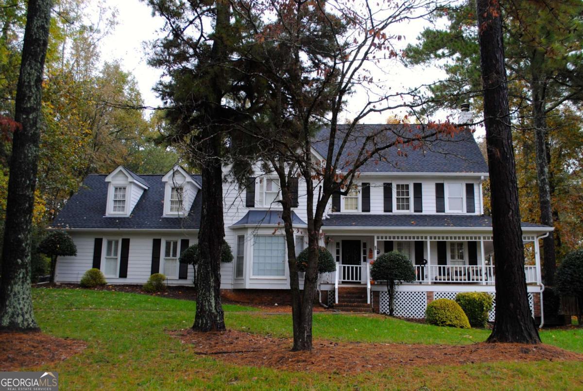 Welcome to this charming Roswell Station retreat, ideally situated just minutes from the vibrant dining and shopping of Canton Street-less than a 10-minute stroll away-and nestled in an active neighborhood with a community pool and tennis courts. Located directly across from Roswell Area Park and in a top-rated school district, this 4-bedroom, 3.5-bath home offers the perfect blend of location, comfort, and outdoor living. A welcoming wrap-around front porch adds to the home's curb appeal, and the back deck overlooks a saltwater in-ground pool and a flat, fenced backyard-ideal for relaxing or entertaining. The backyard feels exceptionally private, backing up to land that cannot be developed. Both the front and back yards are equipped with updated in-ground sprinkler systems, helping maintain the lush landscaping with ease. Inside, there are two primary suite options. The main-level suite provides a peaceful retreat with easy access, dual vanities, large shower, and separate tub. Upstairs you'll find new carpet throughout, including a spacious ensuite bedroom and two additional generously sized bedrooms. Each bedroom features its own large walk-in closet, providing ample storage space. This home also features multiple flexible living spaces to suit a variety of needs. There is a finished rec room-perfect for a home gym, hangout space, or hobby room. Also, above the garage, a separate office/flex room offers additional privacy and could easily serve as a home office, playroom, or guest retreat. Additional highlights include double-paned windows throughout the home, ample storage, and a thoughtfully designed floor plan that adapts to your lifestyle. With a prime location in sought-after Roswell Station, this home is a rare find. Professional photos will be completed soon-please contact the listing agent directly for more information or to request showings once the photos are available.