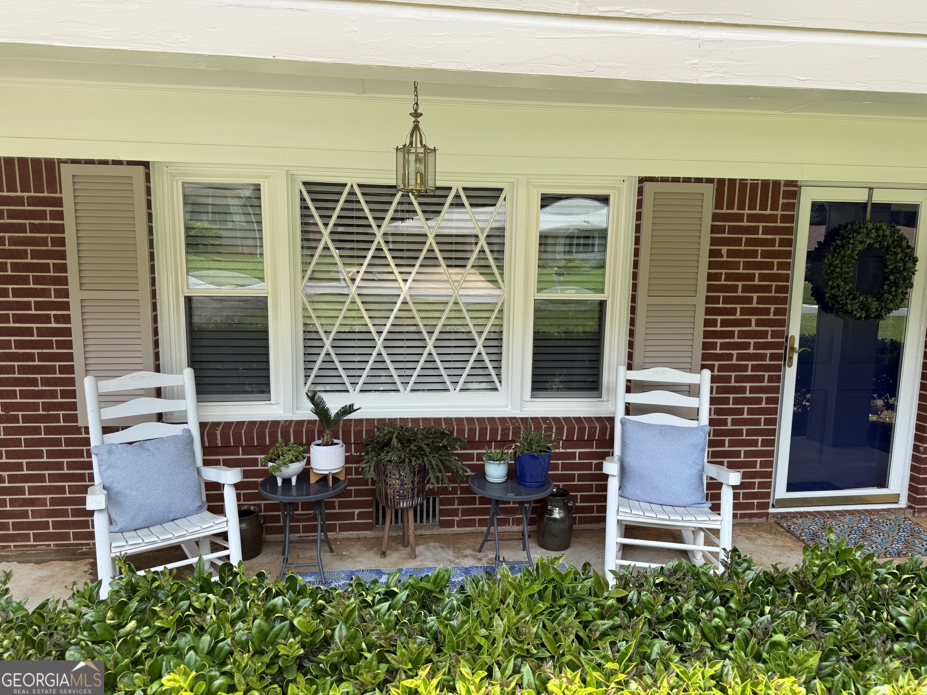 CHARMING RANCH HOME IN TUCKER-Welcome to this beautifully maintained 3 bedroom, 2 bath ranch nestled in the heart of Tucker. Featuring Hardwood floors throughout, this home offers a warm and inviting feel from the moment you step inside. Enjoy the spacious sunroom that overlooks a stunning, private backyard, perfect for relaxing or entertaining. With comfortable living spaces, the kitchen includes quartz countertops, tile backsplash, and glass front cabinets to display your treasures. The Sunroom is 315 square feet, the crawlspace is encapsulated with sump pump system, Recent exterior & interior painting, Roof & gutters 2018, windows replaced 2017, and recently serviced HVAC. There is a storage building that can be used for a workshop or a gardening shed. The rocking chairs on the front porch await you. Conveniently located with a walk to downtown Tucker or quick access to Hwy 78, 285.
