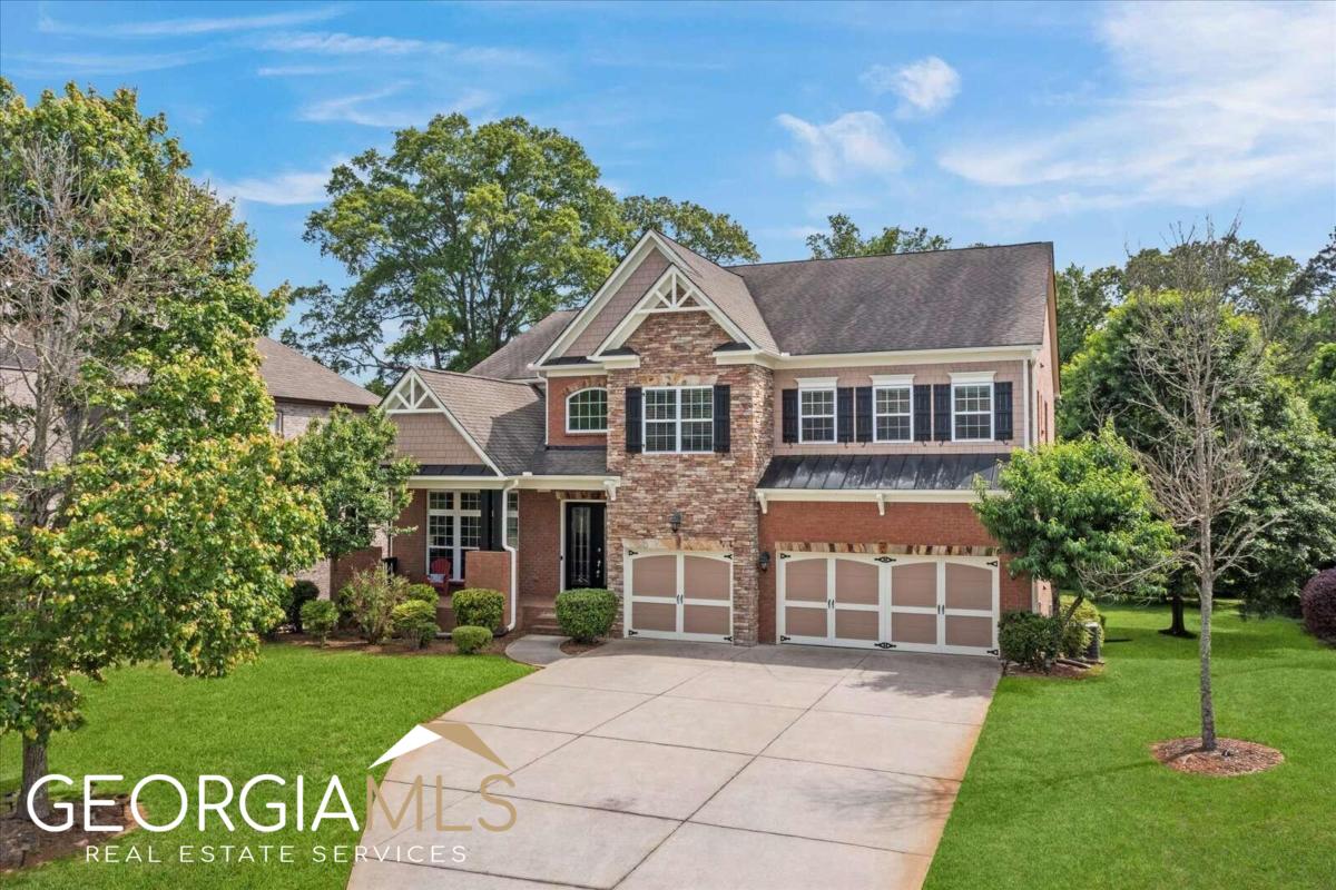 OPEN HOUSE SAT JULY 8TH 1-3PM & SUN JULY 9TH 2-4PM. Come home to this beautiful Marietta home in the Canterbury community! Just 10 min to Downtown Marietta and 15 min to Downtown Woodstock in top rated Cobb County Schools. Gorgeous french door grand entrance from the covered front porch and beautiful brick accents. Stunning two story foyer with gleaming hardwoods, new interior paint and new lighting. Spacious front living room and massive dining room adorned by wainscot walls and an appealing chandelier. Gigantic kitchen with beautiful wood cabinets, granite counters, tiled backsplash, stainless appliances, new microwave and wall oven. Large center island and loads of cabinets and counter space for all your family gatherings. Butler's pantry just off the dining room makes a great space for serving drinks or food. Open concept floorplan. This home boasts a master on main with tall tray ceilings, loads of sunlight, and access to the laundry on main through your closet. A BIG SELLING POINT for everyone. Such a unique and wonderful feature to have. The luxurious bathroom has a massive shower and soaking tub with upgraded tile throughout. It's a place you will love to live. In addition, there are four more bedrooms upstairs, and an additional bonus room. With over 5,000 square feet of living space and an unfinished basement, this home has plenty of space and potential! The bright, 2-story living room open ups to the eat-in kitchen and the upstairs loft area which makes a great space for the kids. 2 sets of Jack & Jill bedrooms await upstairs with spacious bathrooms and their separate shower rooms. Tall ceilings throughout this home. Newer carpet and impeccable condition throughout. Enjoy your coffee on your back deck overlooking your park like private backyard with access to the walking trails from your behind your home throughout the community. You will love this feature. Enjoy this gorgeous amenities of lighted tennis courts, Olympic sized pool, playground, and neighborhood clubhouse. Close to shopping and dining in an ideal Marietta location with easy access to interstate and commutes to Atlanta. Just 7-10 min to Kennestone Hospital or KSU.