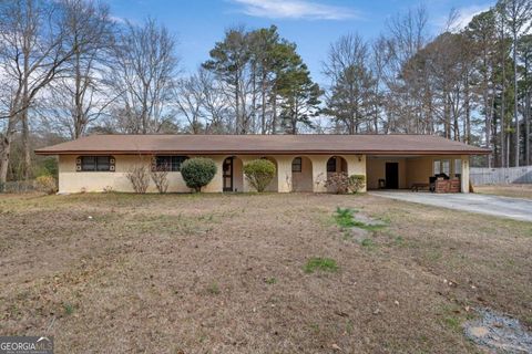 Photo of 5890 Avenue Of Redwoods, Atlanta, GA 30349 (MLS # 10699397)