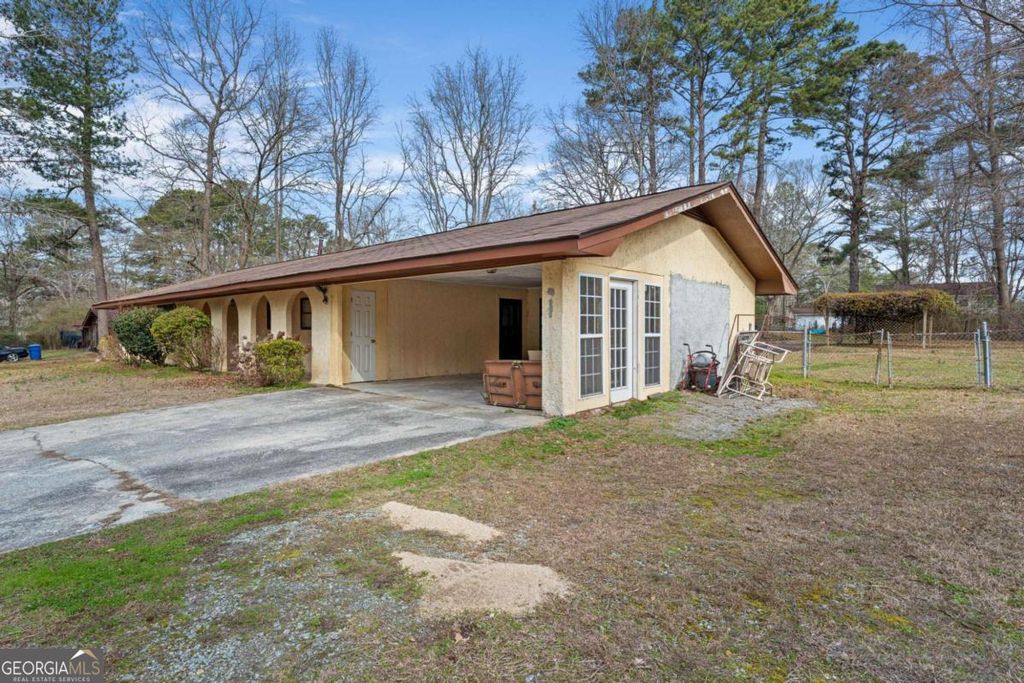 Photo of 5890 Avenue Of Redwoods, Atlanta, GA 30349 (MLS # 10699397)