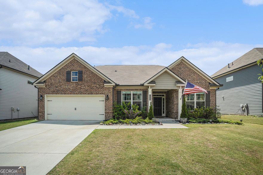 Better than new RANCH in Ansley Park! This charming 3-bedroom, 2.5-bathroom ranch perfectly blends modern convenience and timeless elegance. Discover a stunning open-concept living space adorned with luxury vinyl plank flooring and bathed in natural light. The gourmet kitchen, equipped with white cabinetry, complementing granite countertops, stainless steel appliances, and a large center island, is ideal for gatherings. Adjacent to the kitchen, the breakfast area opens up to a spacious private fenced backyard featuring a covered patio with a custom retractable awning & plenty of room for outdoor activities. The oversized primary suite is a private retreat with tray ceilings, a sitting area & a spa-like bath featuring dual vanity, a double walk-in shower, and an oversized closet. Two secondary bedrooms share a bath. Barn doors provide privacy in the home office or flex space. The home also boasts a cozy living room with a fireplace and a separate dining room. Neighborhood amenities include a pool, tennis courts & a playground. Located in the sought-after West Forsyth High School District and is conveniently close to shopping, dining, and recreational facilities.
