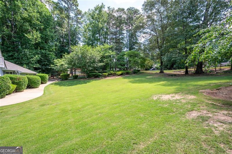 ?Prime Tear-Down Lot in Prestigious Sanders Field Estates - A Rare Opportunity! This tear-down/lot won't last long! Nestled in the highly sought-after Sanders Field Estates on the prestigious Woodlawn Drive, this property is a rare opportunity to build your dream home in one of COBB County's finest neighborhoods. Location, Location, Location!? Top-Rated Schools - Zoned for Sope Creek Elementary, Dickerson Middle, and Walton High School?. Unbeatable Convenience - Minutes from Sope Creek, top shopping, dining, and entertainment?.? Exclusive Community - Located just outside the Atlanta Country Club, surrounded by luxury homes?. Lush Landscaping - A picturesque setting for your custom-built estate This lot is currently occupied - appointment only for viewings. The seller is in the process of locating the survey, but one is not currently available. Don't Miss Out! Contact us today to schedule a showing and explore the possibilities of this incredible lot.
