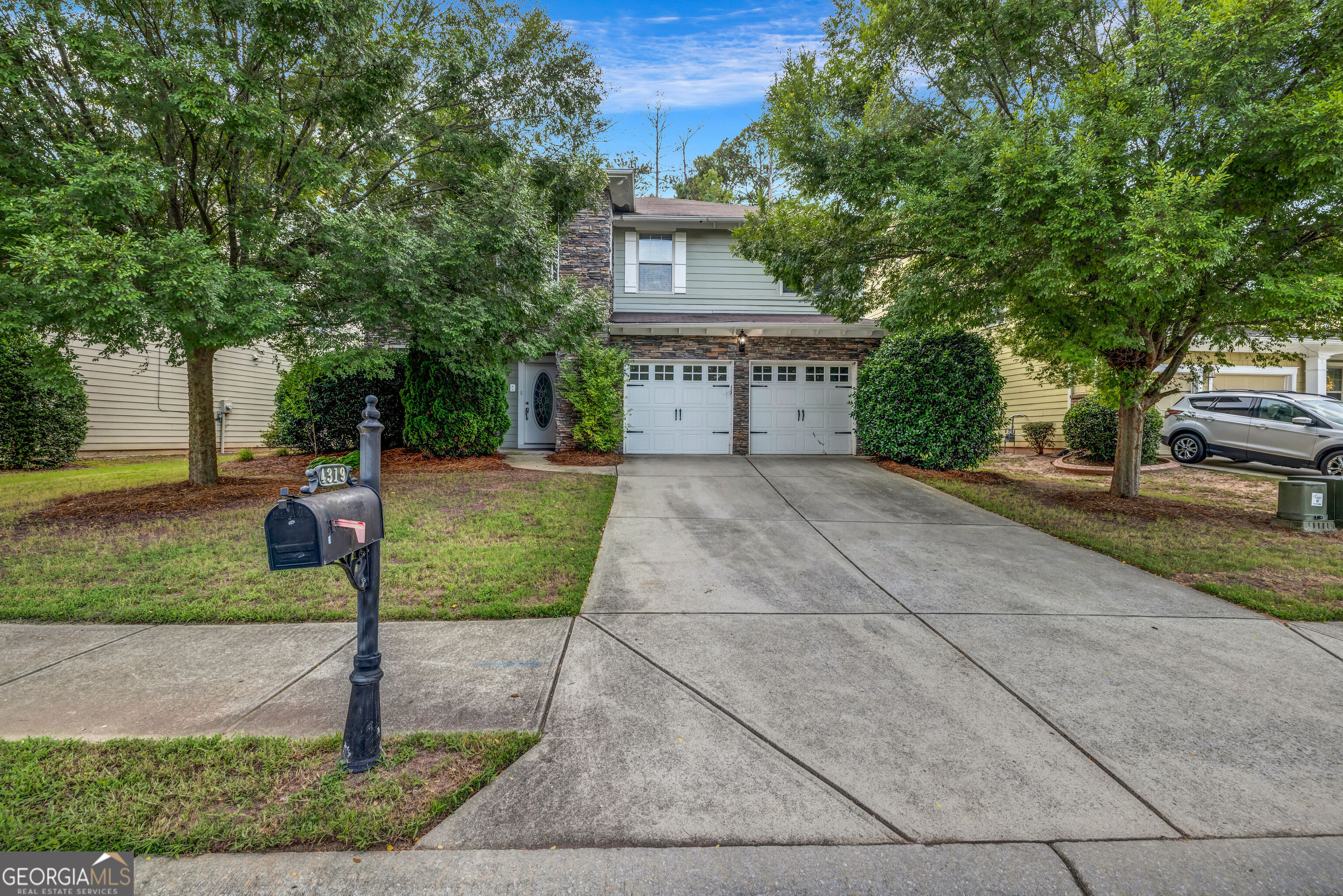 This beautiful two-story home, located in the highly sought-after Hampton Oaks community, showcases one of the original and most desirable floorplans in the neighborhood. The heart of the home is the massive chef's kitchen, complete with a generous center island, solid surface countertops, and stainless steel appliances-perfect for both everyday cooking and entertaining. The main level offers a bedroom and full bathroom, ideal for guests or multi-generational living, as well as spacious living areas that provide comfort and functionality. Upstairs, you'll find a versatile loft area that can be used as a home office, playroom, or media space. The luxurious primary suite boasts a walk-in closet and a spa-inspired bathroom with dual vanities, a soaking tub, and a separate shower. Step outside to enjoy a fully fenced backyard with an oversized patio-perfect for hosting gatherings, grilling out, or simply relaxing in your private outdoor space. Hampton Oaks is a well-maintained community that offers beautiful amenities and a welcoming atmosphere, making this home an exceptional opportunity in one of the area's most coveted locations.
