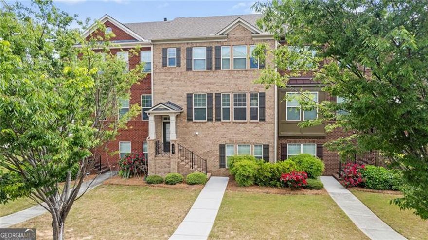 MOVE IN READY!  LOCATION! LOCATION! just minutes away from GA-400, Avalon, Halcyon, and the vibrant Downtown Alpharetta area. Welcome to your dream home, 3 bedrooms, 3 full baths, and a half bath Brick Townhome in coveted Deerfield Green! Step inside to discover a bright dining space adorned with a chic chandelier, ideal for entertaining. The gourmet kitchen impresses with granite countertops, and stainless steel appliances, effortlessly connecting to a spacious living area featuring built-ins and a cozy fireplace. Large deck is ideal for entertaining and grilling! Upstairs, the oversized master suite awaits, complete with a tray ceiling, walk-in closet with custom shelving, and a luxurious ensuite bath featuring a double vanity, a soaking tub, and a separate shower. An additional bedroom with a private ensuite bath is located on this level, along with a laundry room for added convenience. The finished lower level features a private bedroom and full bath providing a flexible space that can serve as a guest suite, teen retreat, or home office. This townhomeCOs community amenities include a pool, playground, sidewalks, Two Car Garage and ample guest parking, ensuring an enriched lifestyle. Located in Top-rated schools! Near shopping, groceries, dining, coffee houses and entertainment options, this home embodies comfort and convenience.