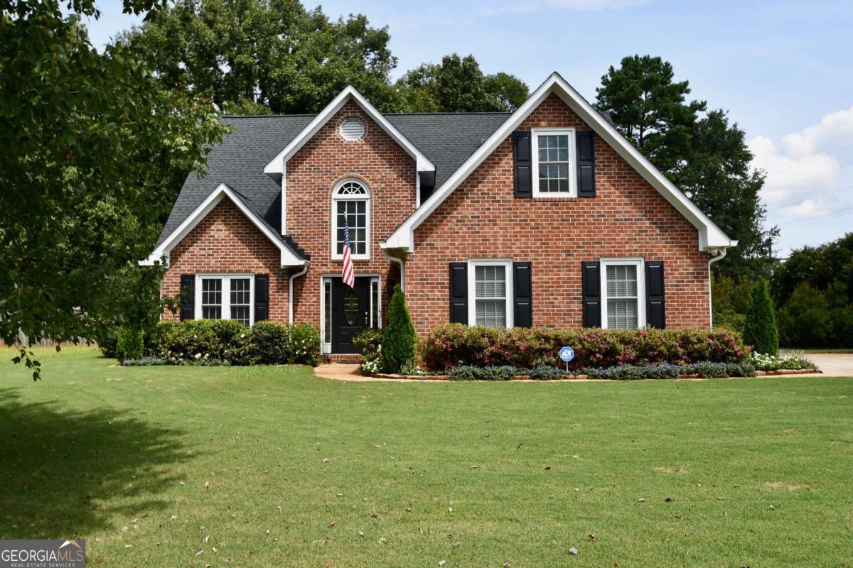 Located in East Athens is this charming, traditional property boasting four bedrooms plus a sunroom! Step inside to find a light-filled floor plan featuring spacious living areas, neutral finishes, and thoughtful updates throughout. The inviting two-story foyer opens to the main living areas of the home. The living room flows seamlessly into the kitchen and dining spaces, creating an ideal setup for both daily living and entertaining. The kitchen offers ample cabinetry, modern appliances, and plenty of counter space for meal prep. The home offers comfortable bedrooms with generous closet space, including a relaxing primary suite located on the main level with an updated ensuite bathroom. Outside, enjoy a private backyard with room to garden, play, or simply unwind. The three season room is perfect for gathering with friends. Sited in a quiet, established neighborhood, this home combines a peaceful setting with close proximity to Eastside conveniences, schools, and parks.