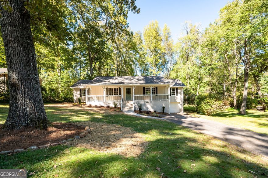 RENOVATED and READY TO SELL!  Farmhouse chic retreat, perfectly situated on a quiet street in Harrison HS district. The spacious covered front porch invites you to relax and unwind, offering an ideal spot to enjoy your morning coffee or evening sunsets. Step inside to find stunning pecan hardwood floors that flow throughout, creating a warm and inviting atmosphere. This three bedroom, two bath home boasts modern updates, including bathroom vanities, newly painted kitchen cabinets with quartz counters, backsplash, new top-of-the-line appliances, new lighting, hardware, LVP flooring and fresh interior paint that enhances its timeless appeal. The ranch floor plan and open layout maximizes natural light and makes entertaining easy. The nice size bonus room with brick wall is a perfect space for a home office, library, or playroom. This home offers a one car garage with extra storage space, plus a shed/workshop with power. Additional renovations include a brand-new roof, freshly painted exterior with farmhouse shutters, new lighting, porch railing and thoughtfully designed landscape. Don't miss this opportunity to own a classic farmhouse with the charm and conveniences of modern living. Schedule your showing today!