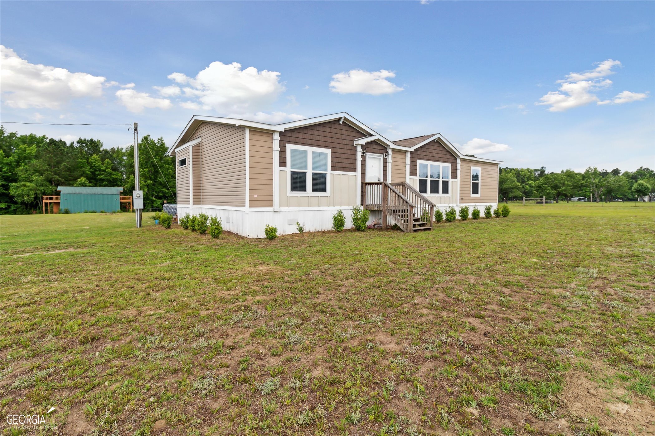 This charming mobile home is nestled in the heart of an open, green 5 acre lot. Offering an opportunity to own a serene escape from the hustle and bustle of city life without being far removed from opportunity and convenience. This property boasts stunning rural views and ample outdoor space to explore and enjoy. The well-maintained home is installed on a permanent foundation, providing three bedrooms, two bathrooms, and open living spaces throughout its 1,484 sq ft. Outside, the possibilities are endless. Whether you're looking to start your garden, raise animals, or just enjoy nature out by the pool, this property has it all. At the rear of the property you will find a 20' x 30' barn fitted with electricity. If you're looking to find a place to make your future homestead, come out and see what 827 Bell Rd has to offer. Call today for a private showing!